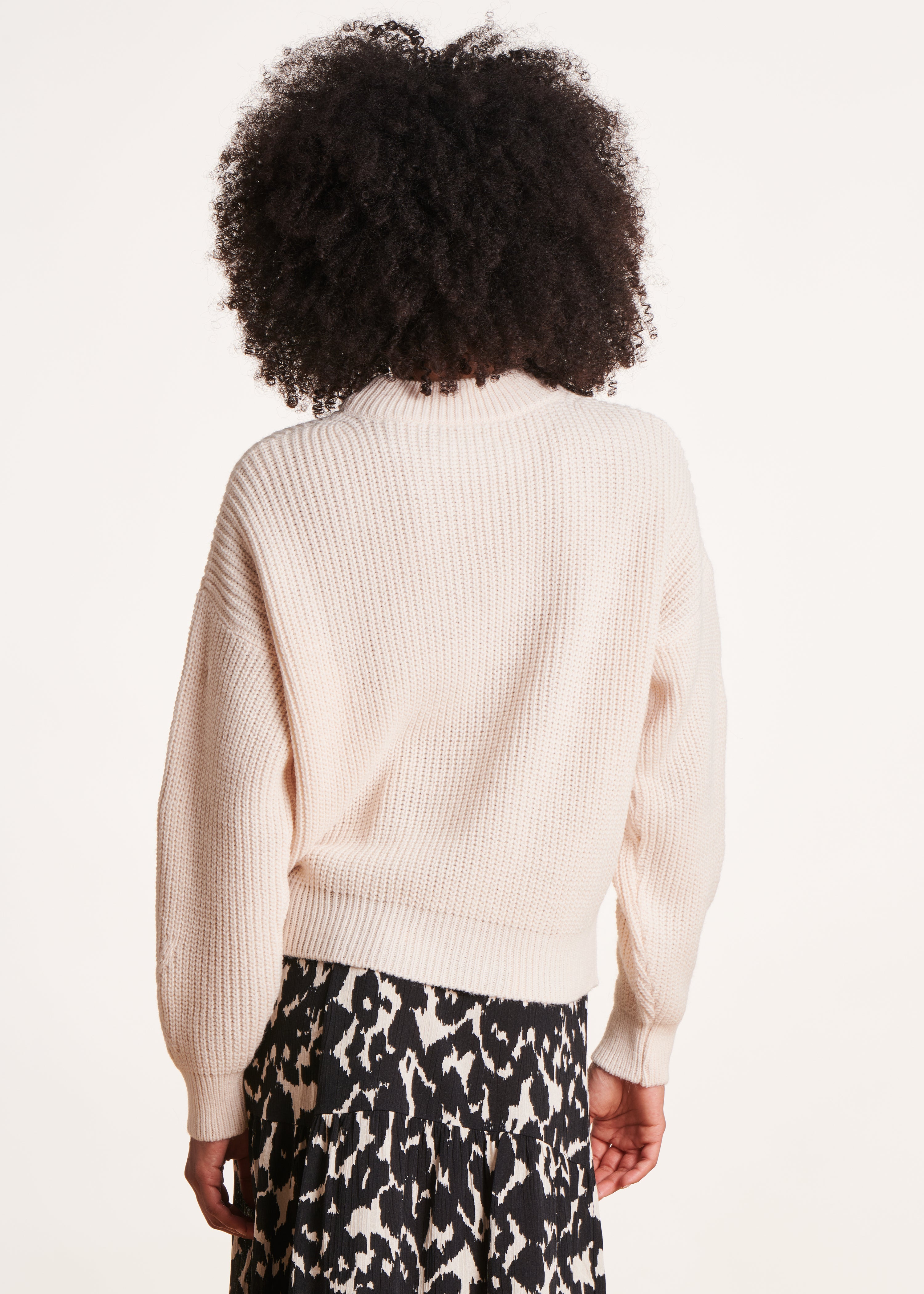 Ecru sweater with high collar in beaded rib knit