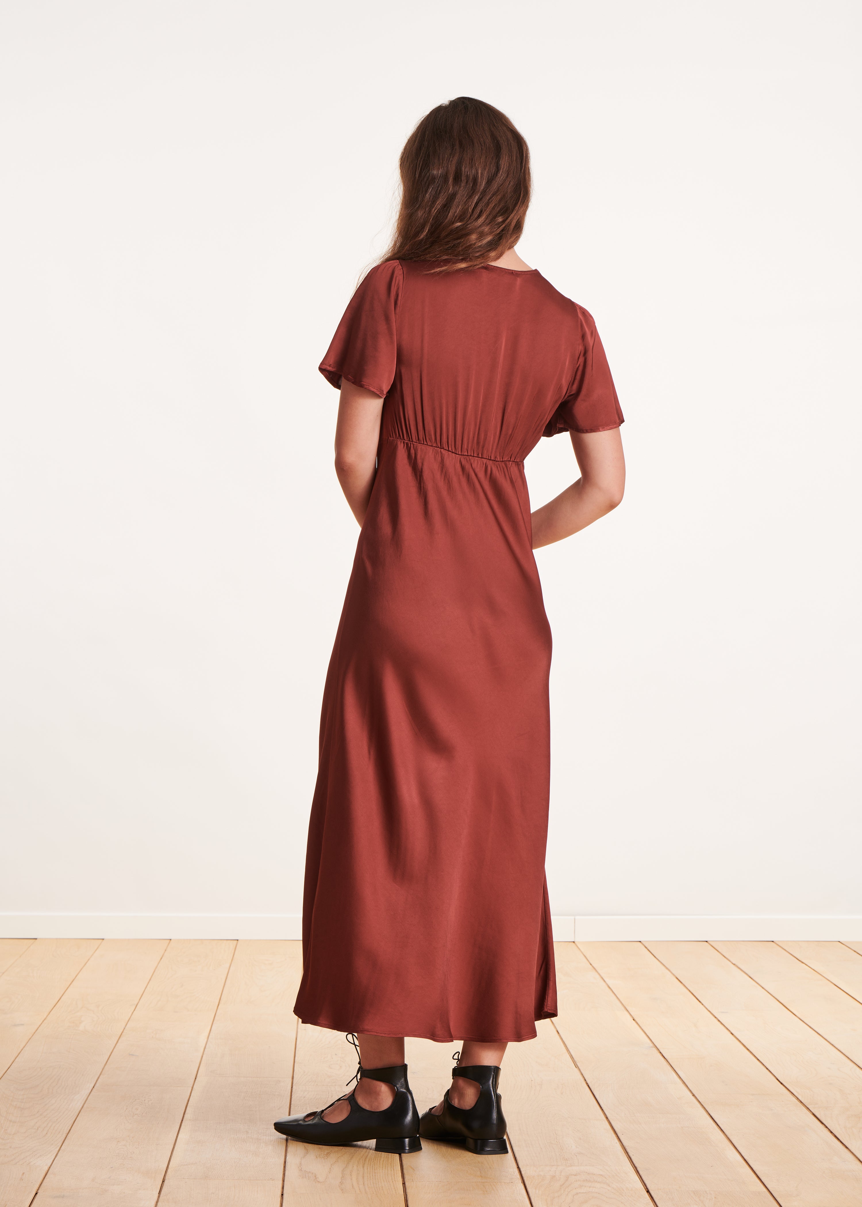 Long flowing burgundy fitted dress with short sleeves