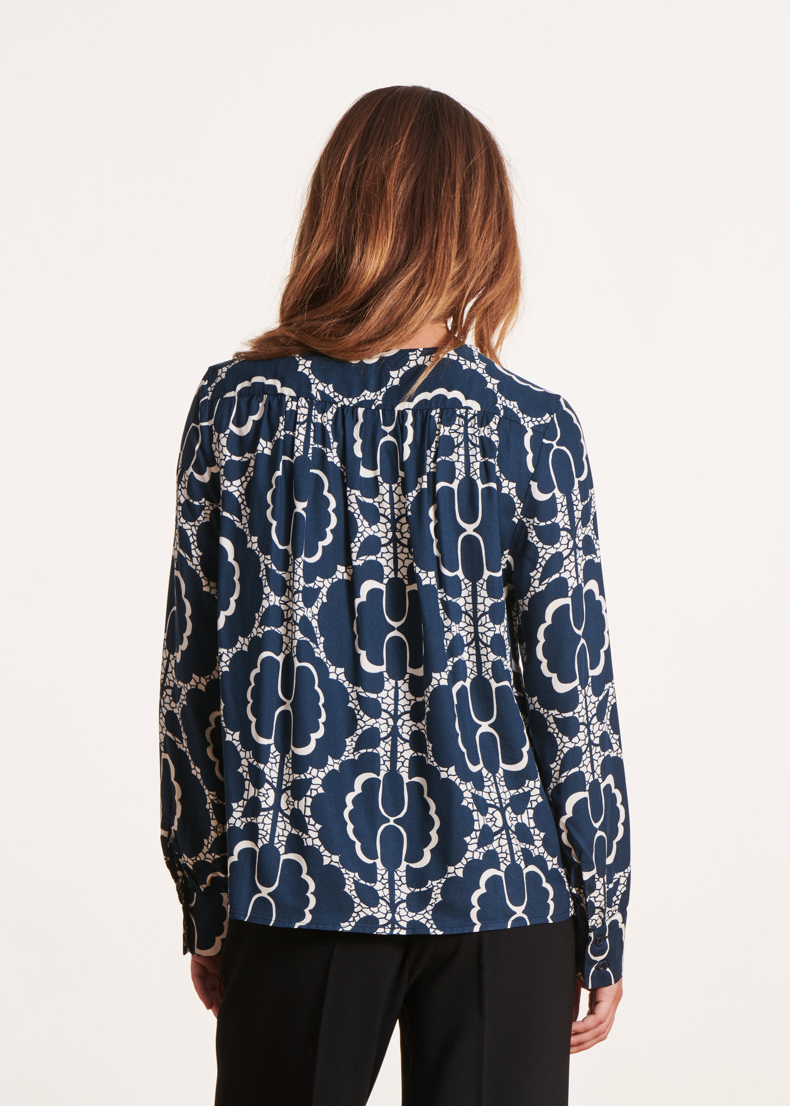 Long-sleeved blue and white print top