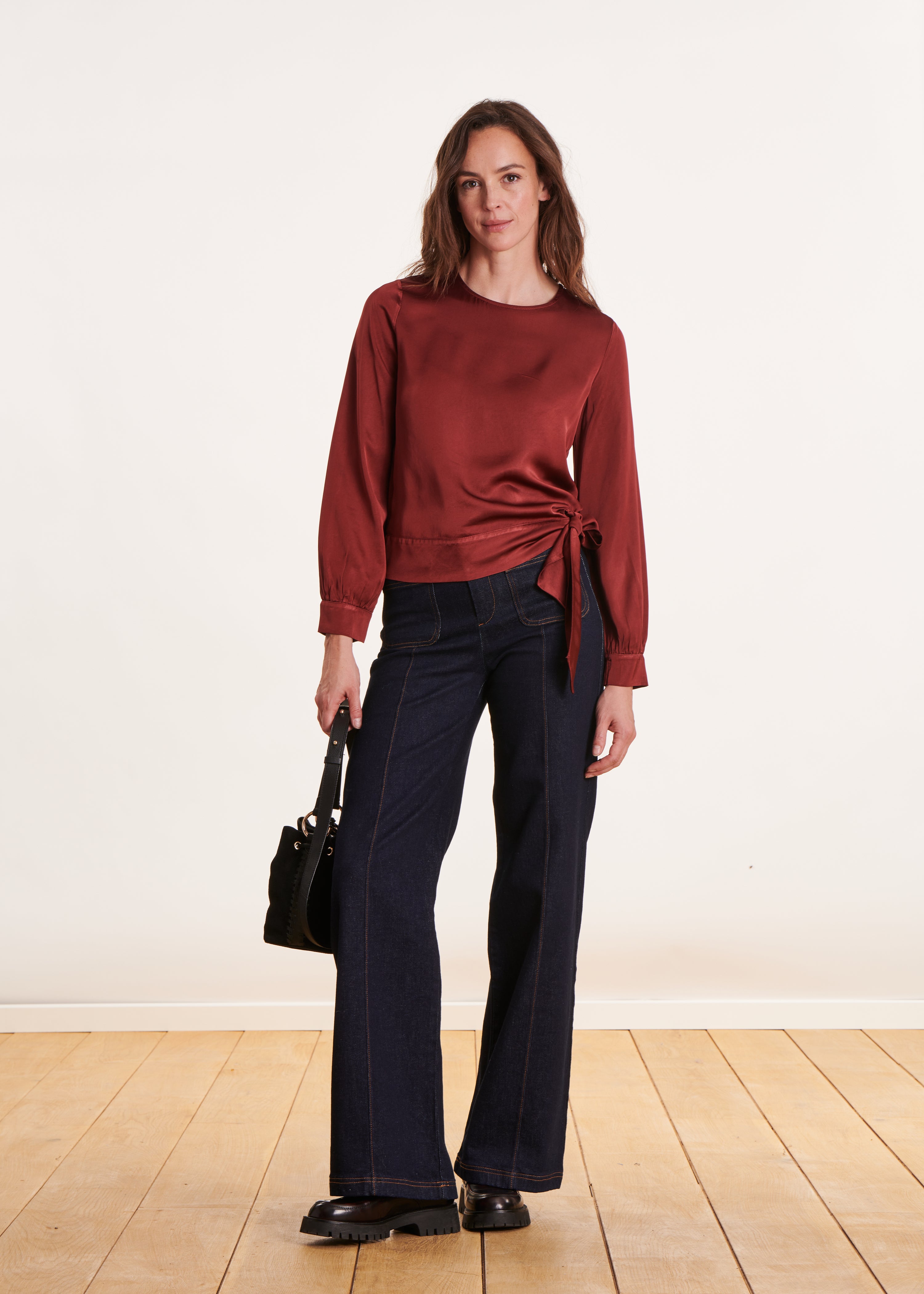 Loose and flowing burgundy top with long sleeves