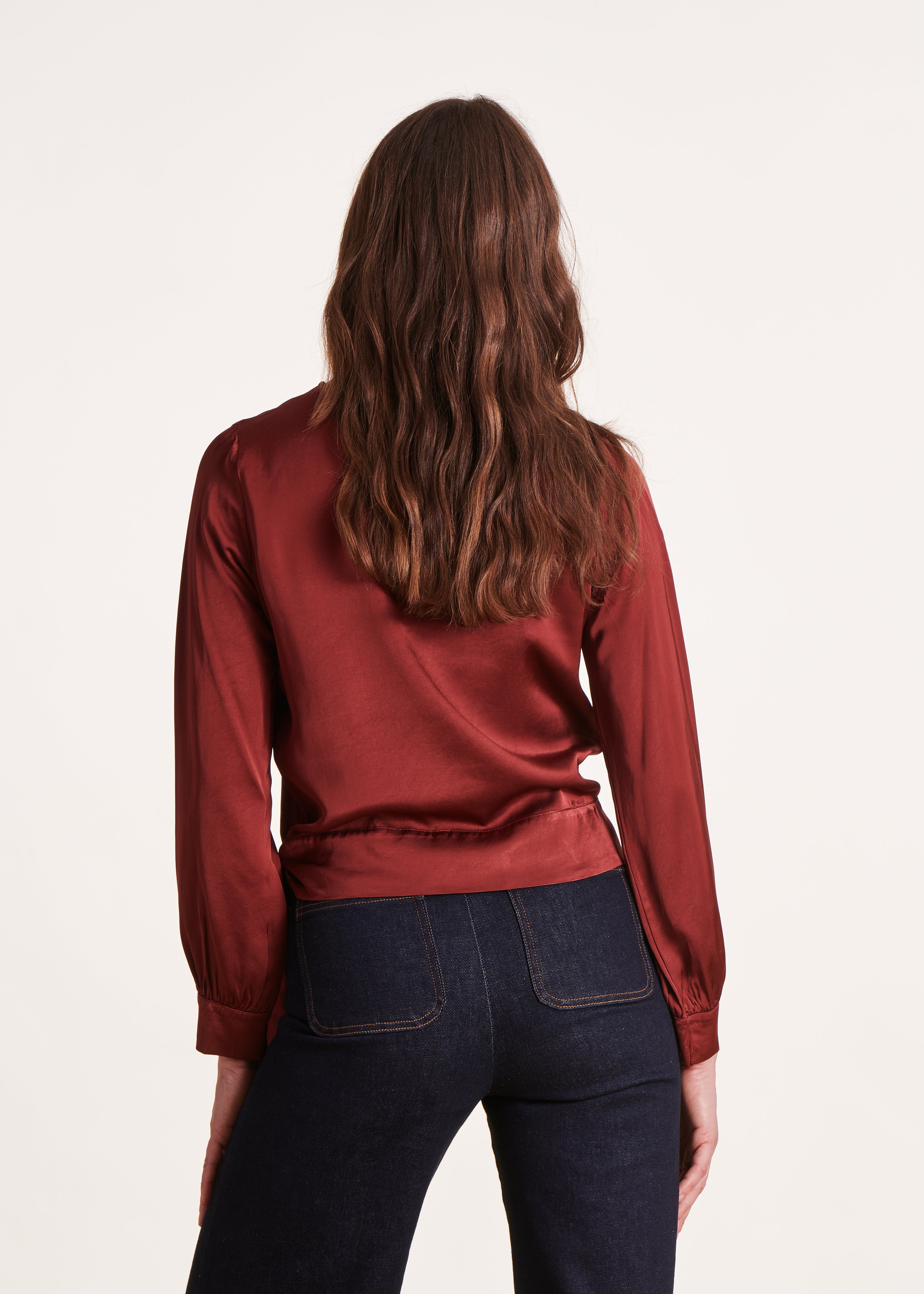 Loose and flowing burgundy top with long sleeves