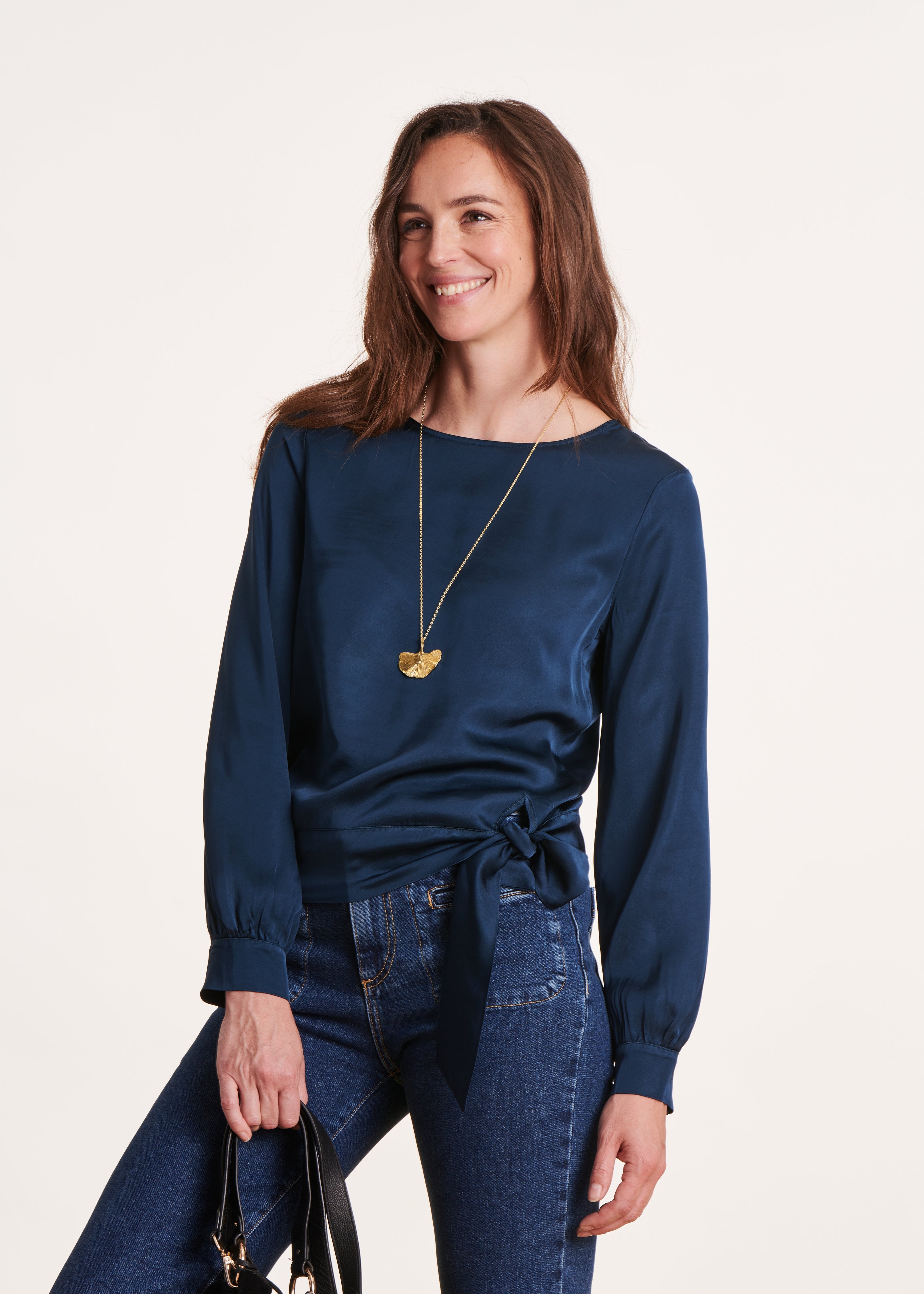 Loose and flowing petrol blue top with long sleeves