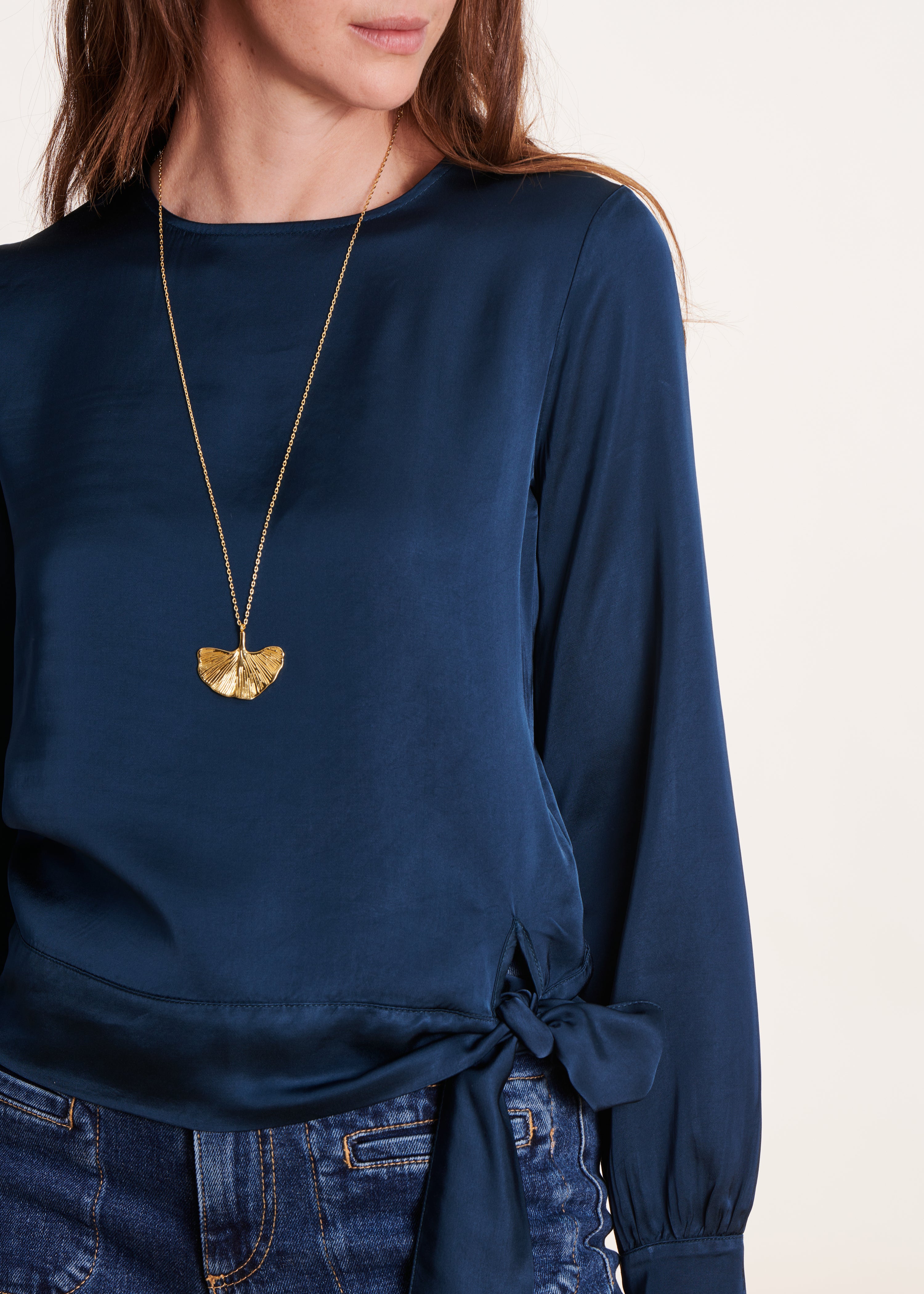 Loose and flowing petrol blue top with long sleeves