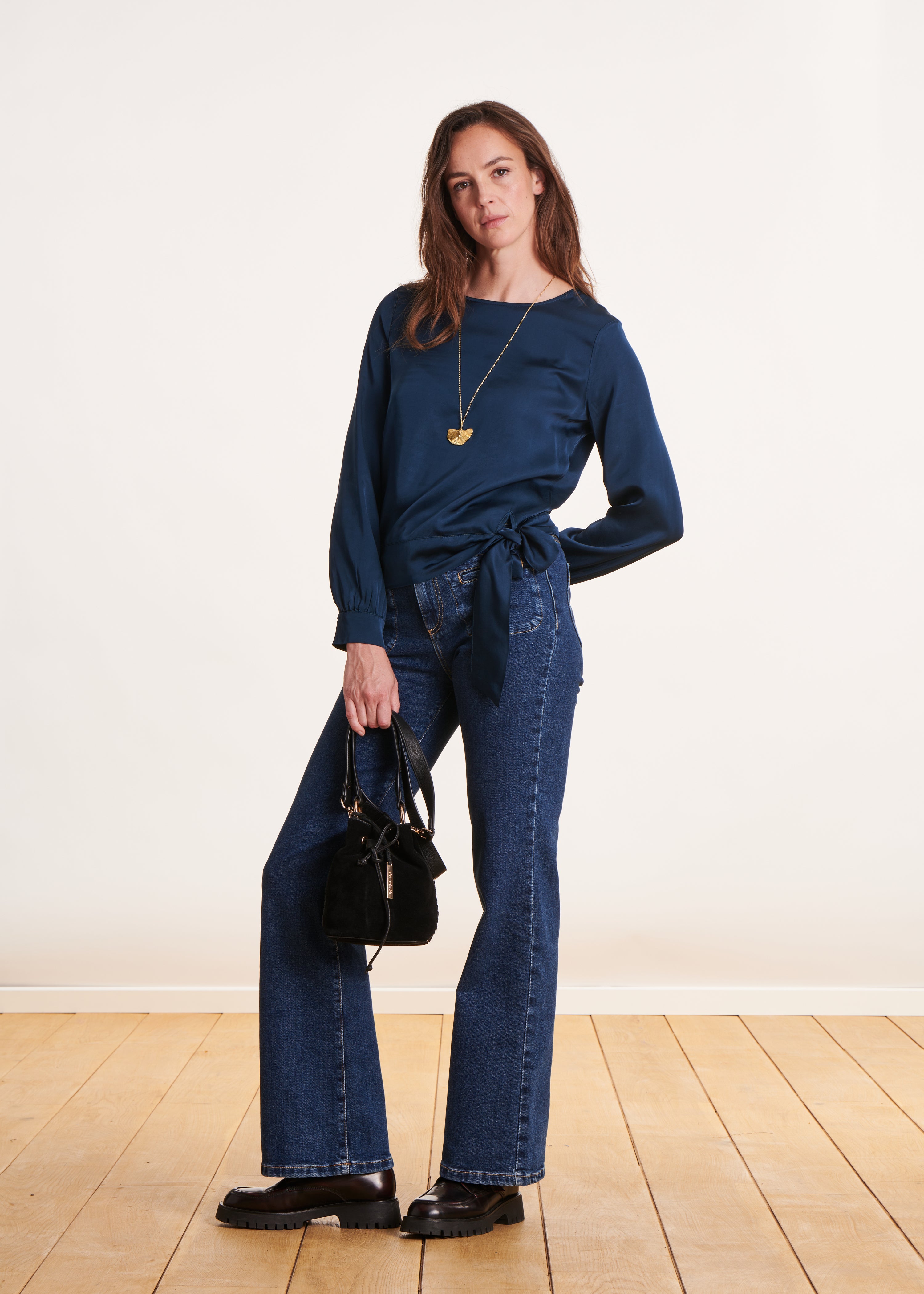 Loose and flowing petrol blue top with long sleeves