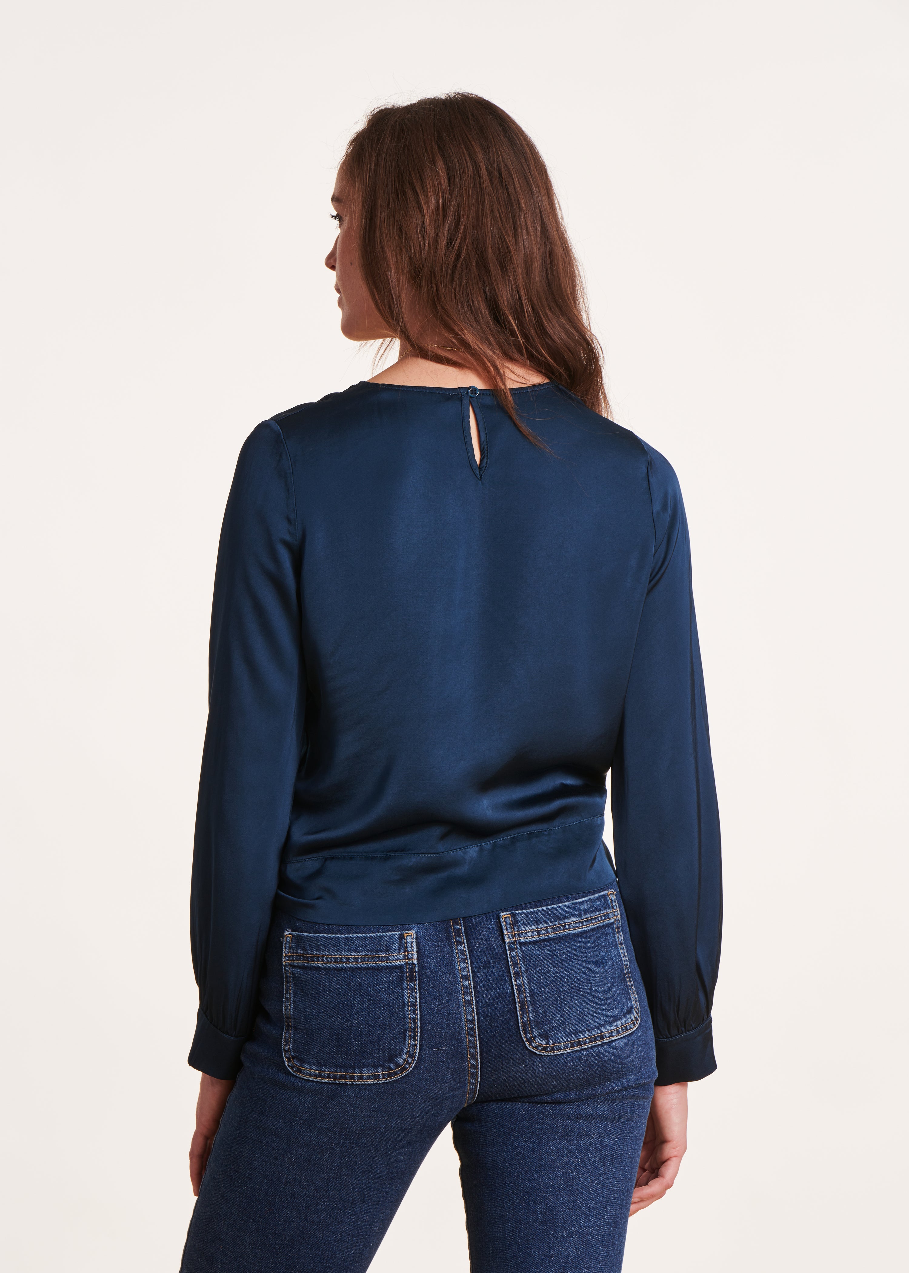 Loose and flowing petrol blue top with long sleeves