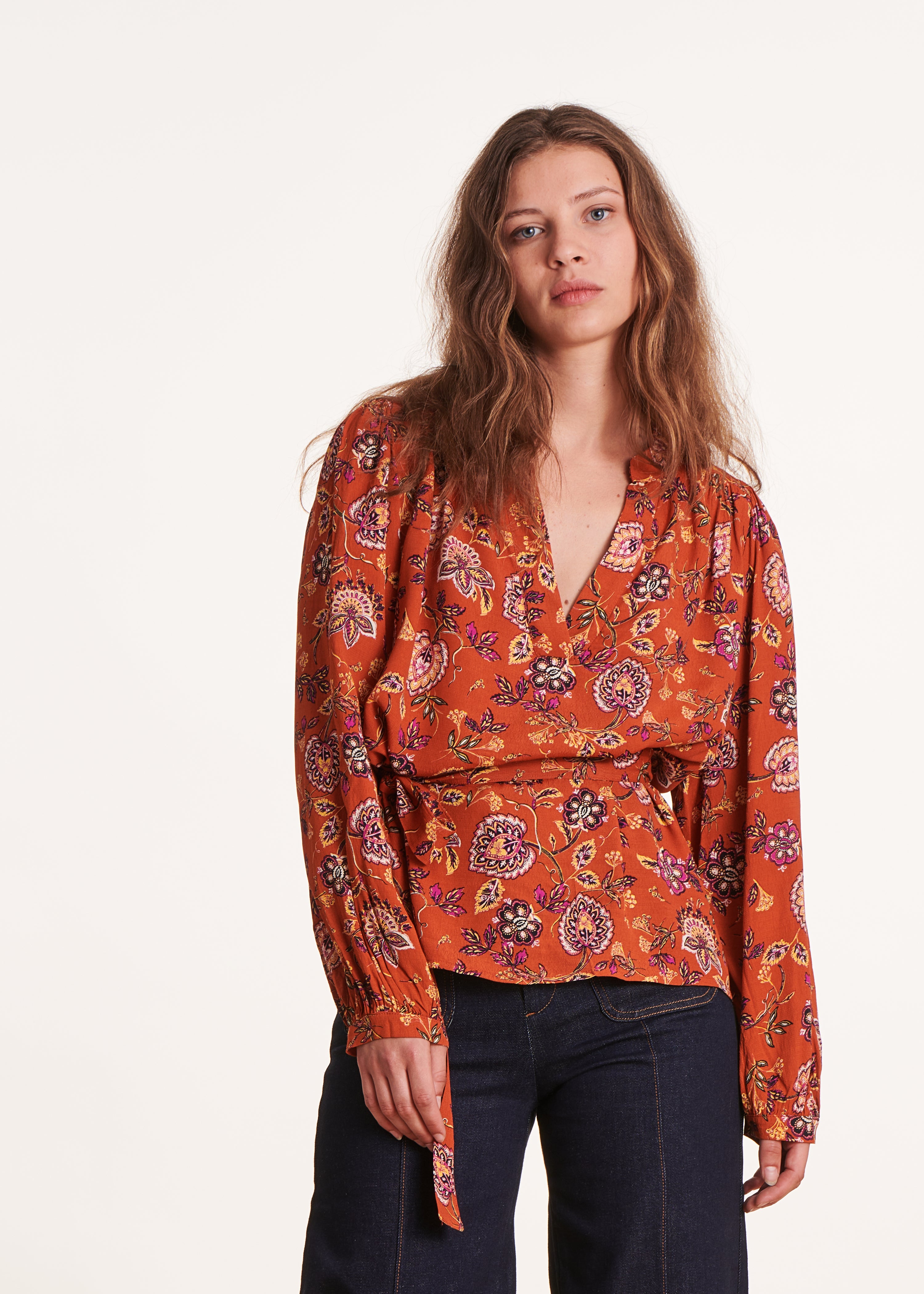 Loose orange top with floral print