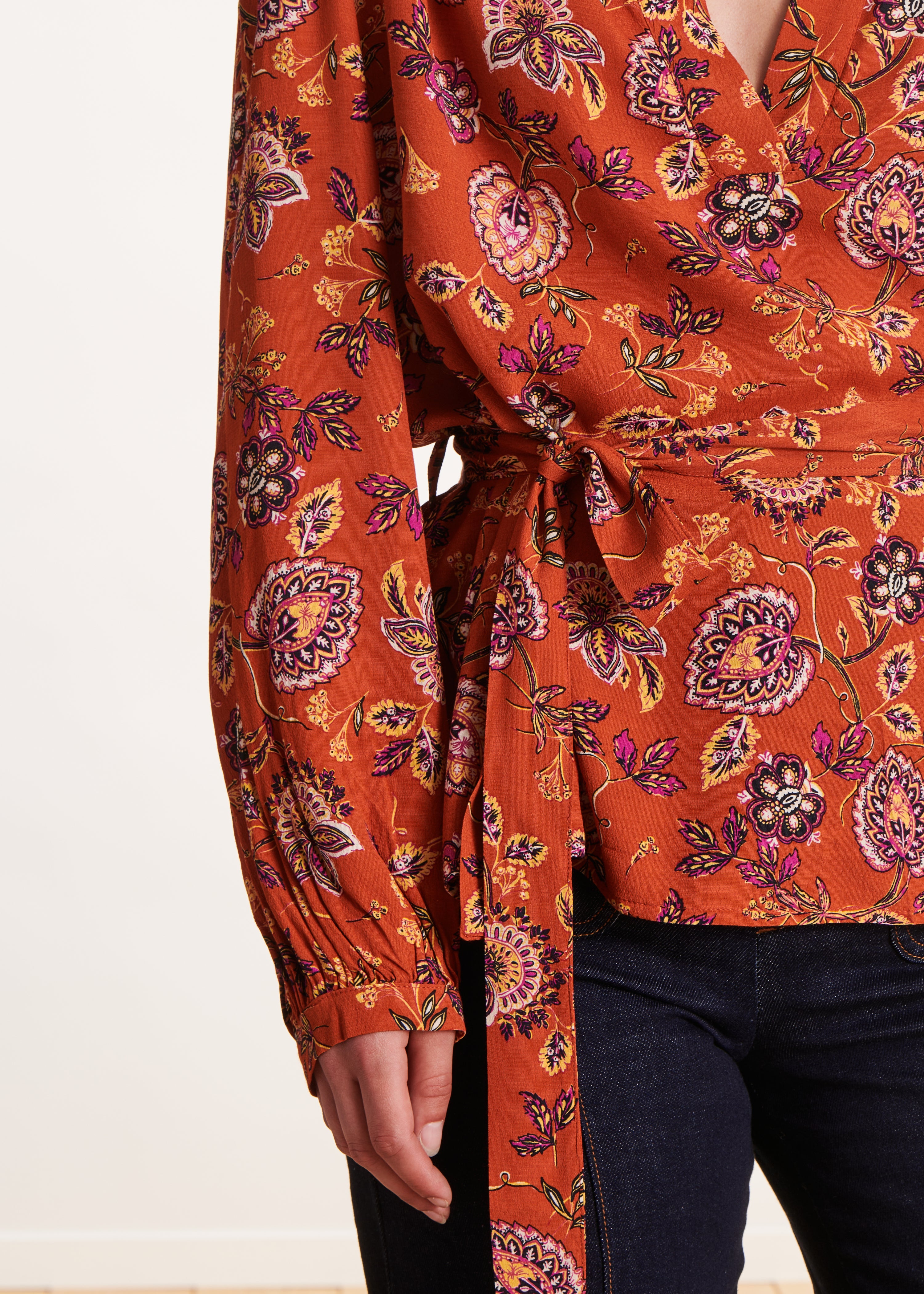 Loose orange top with floral print