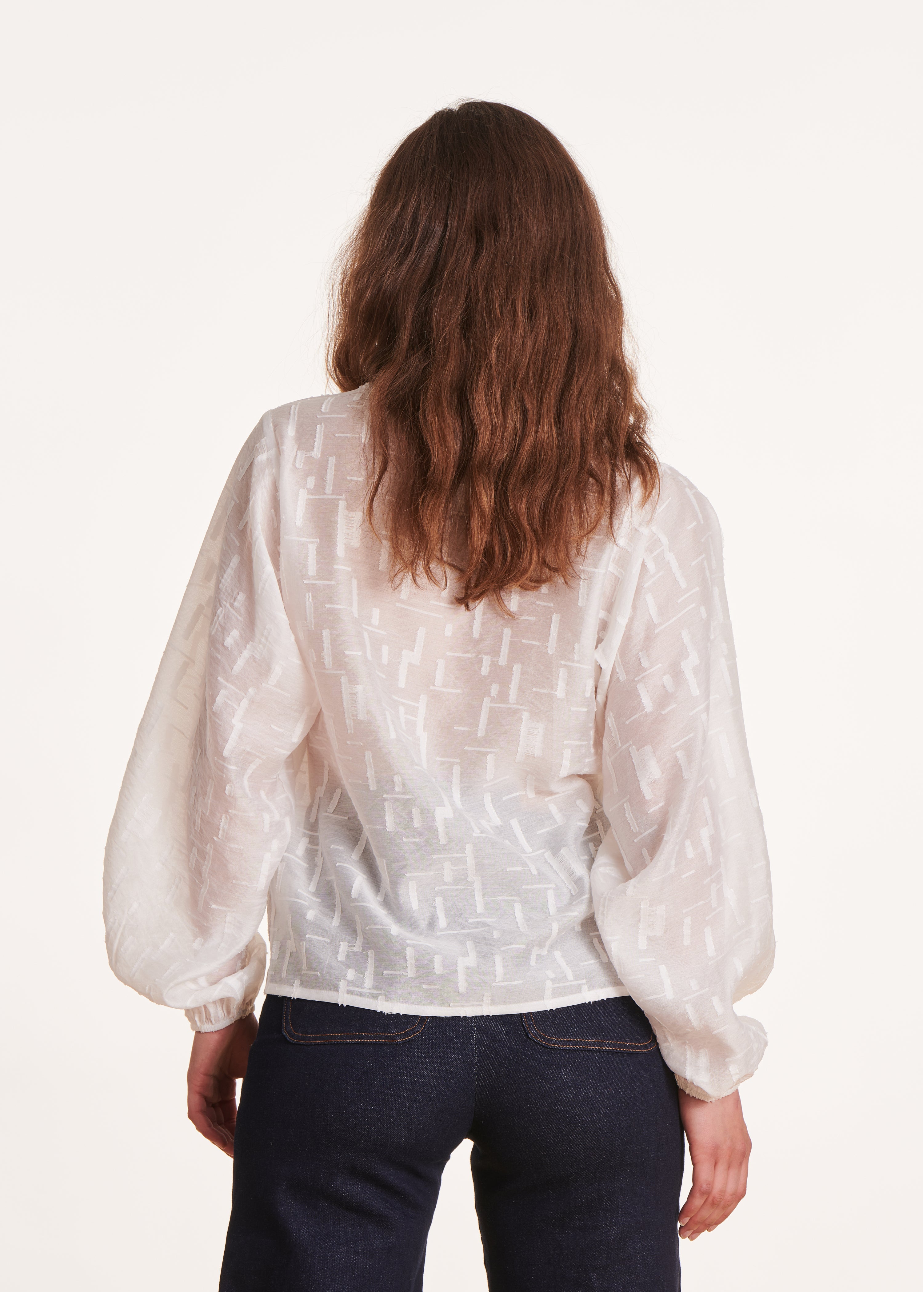 Loose-fitting long-sleeved white voile top