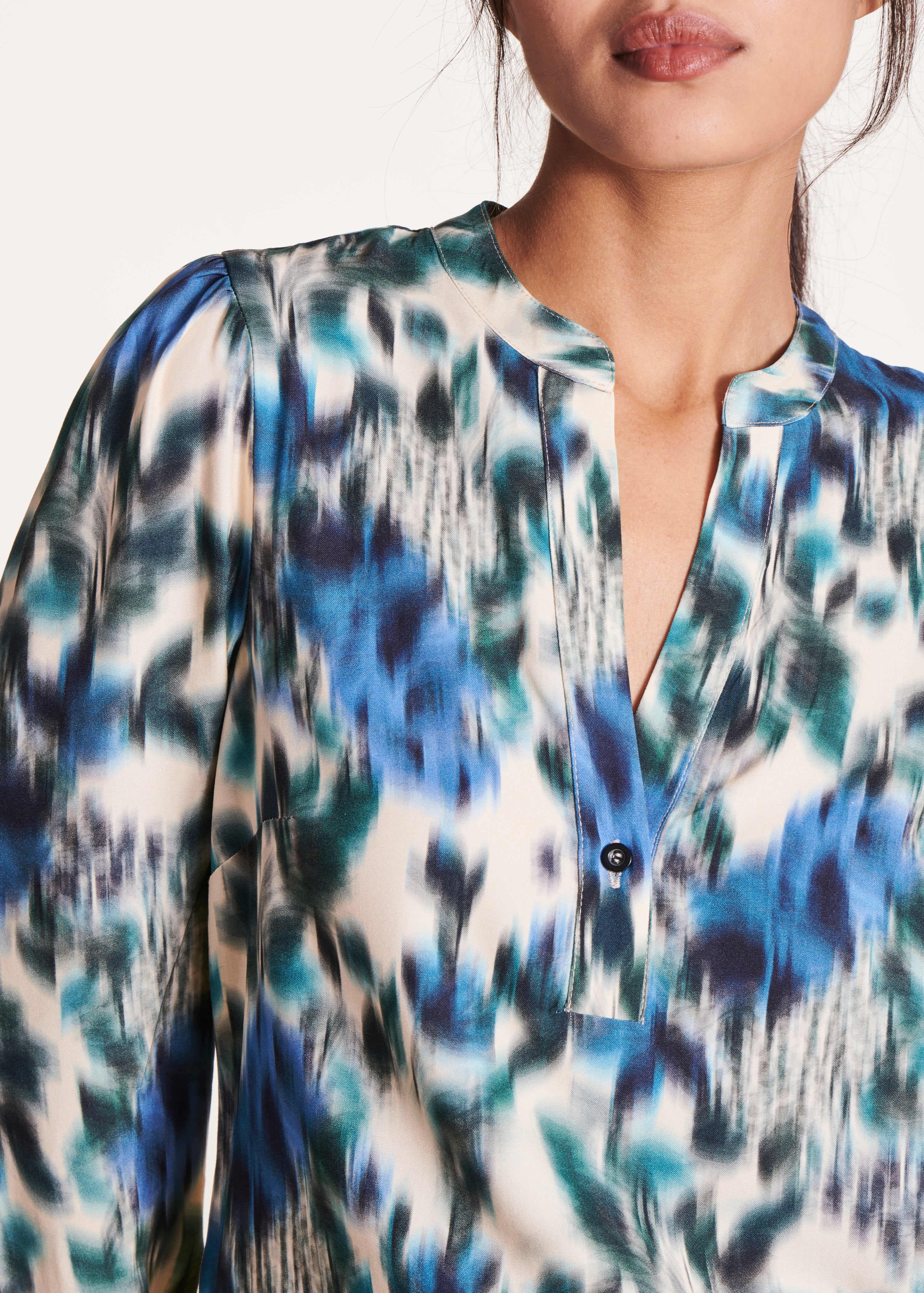 white and blue print long-sleeved top