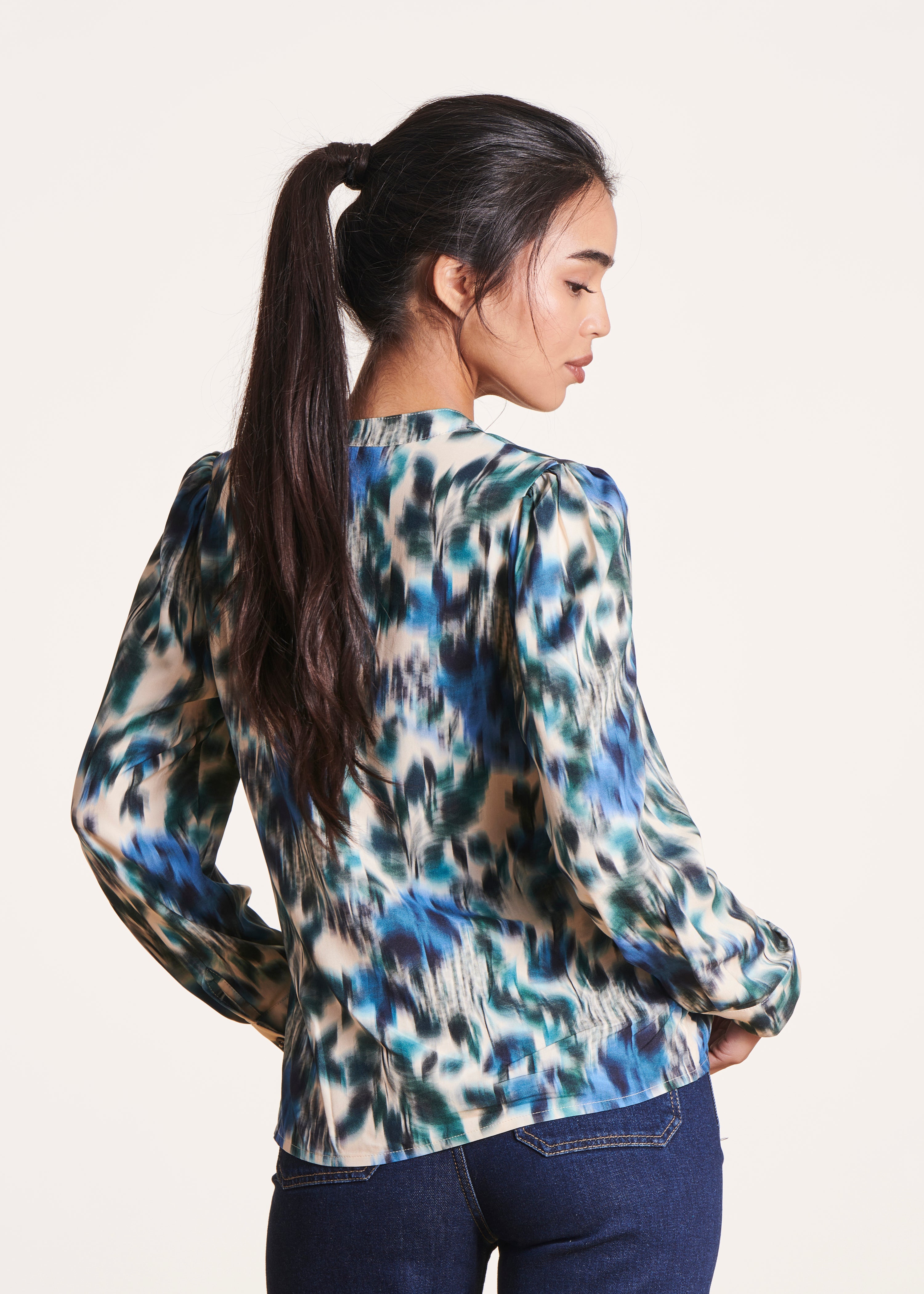 white and blue print long-sleeved top