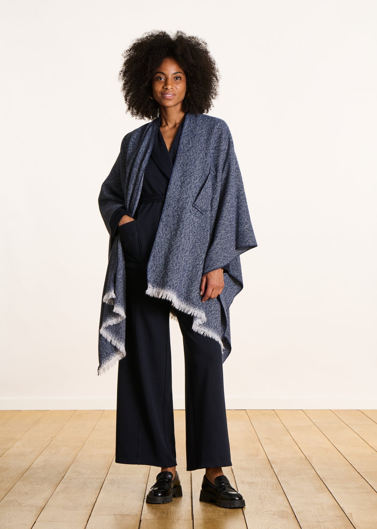 Blue denim poncho with fringes
