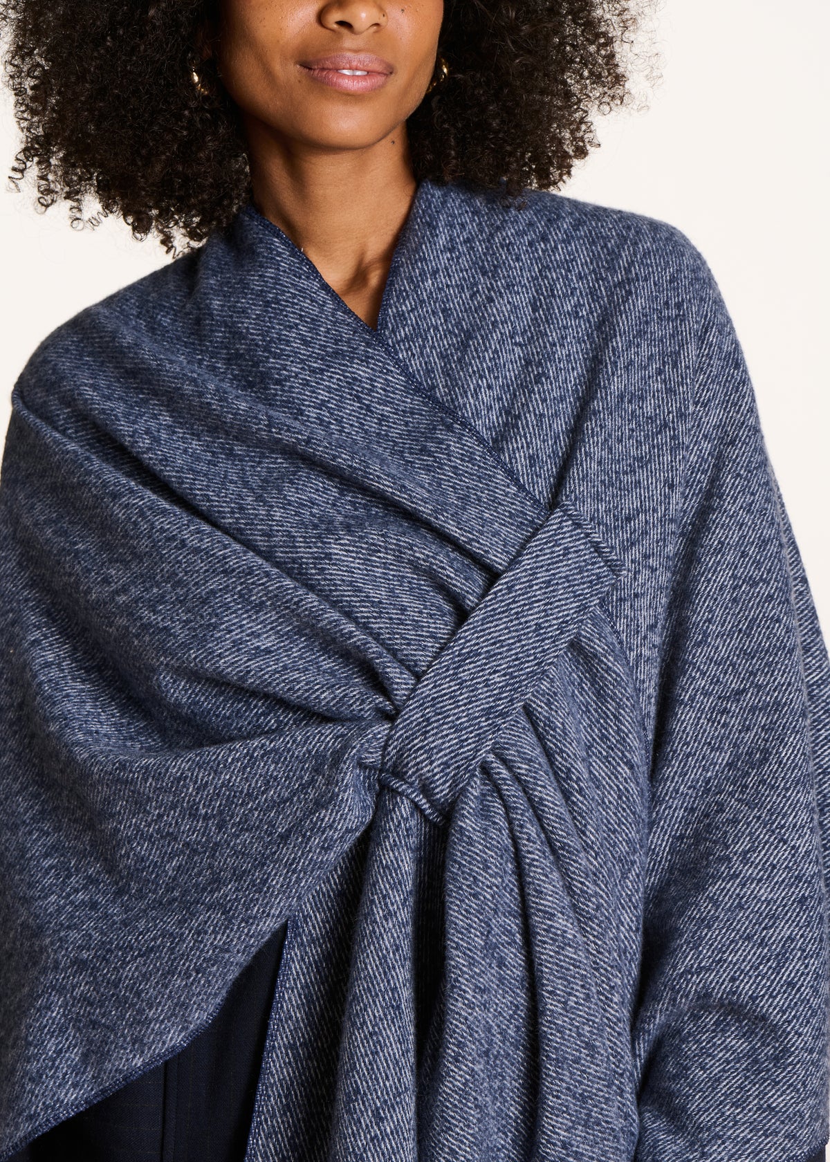 Blue denim poncho with fringes