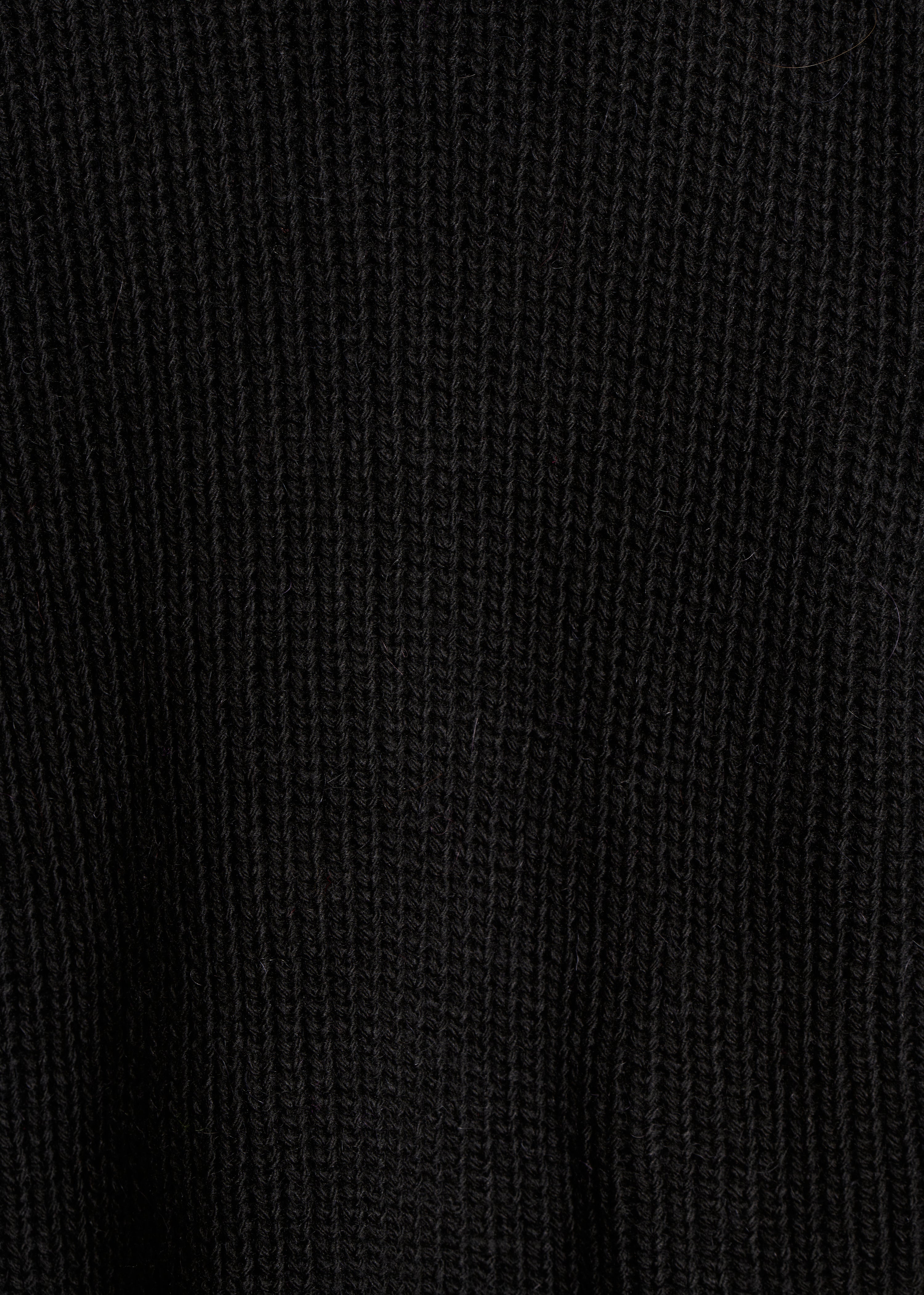 Colete curto sem mangas preto em malha canelada pérola