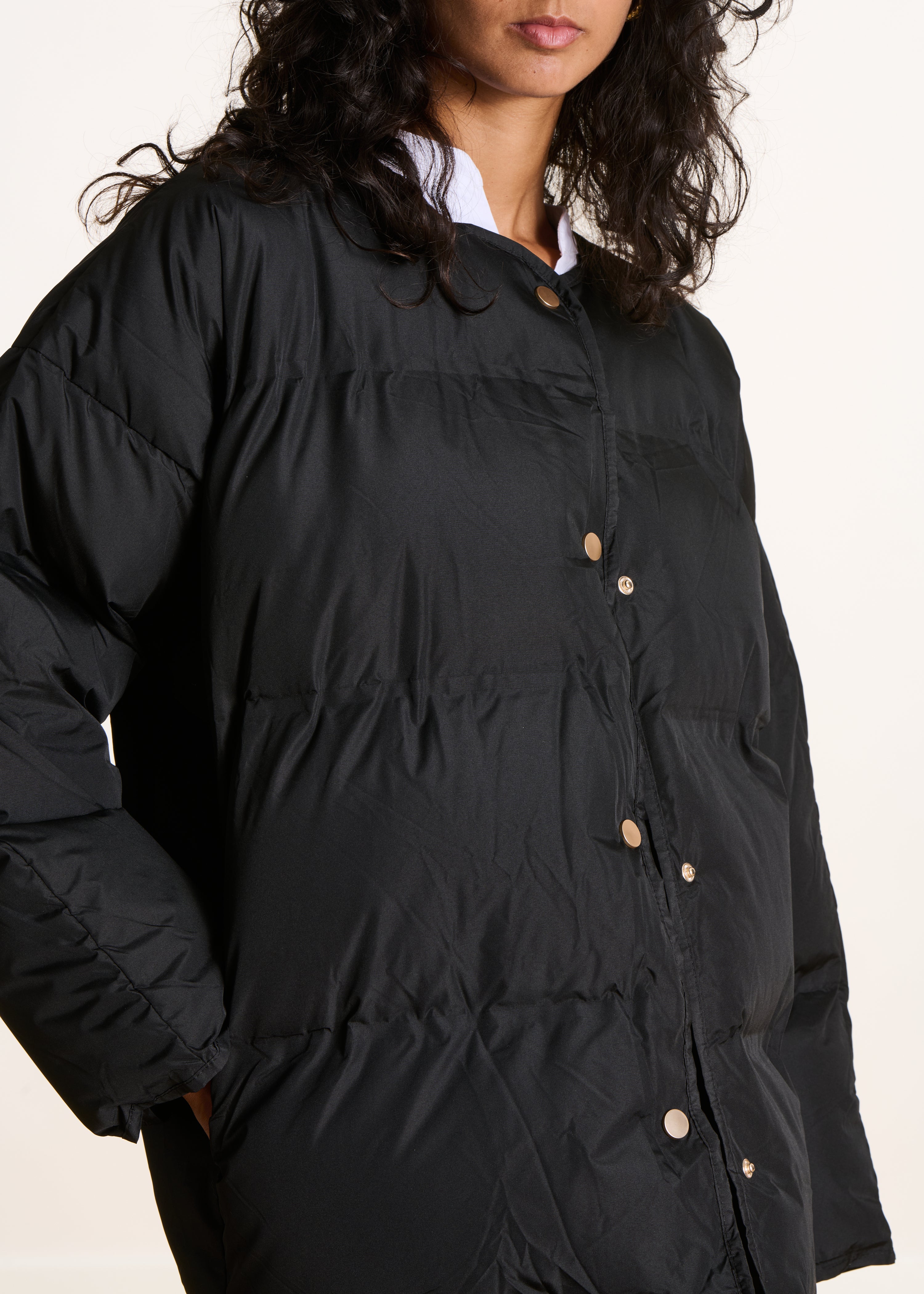 Short black quilted down jacket
