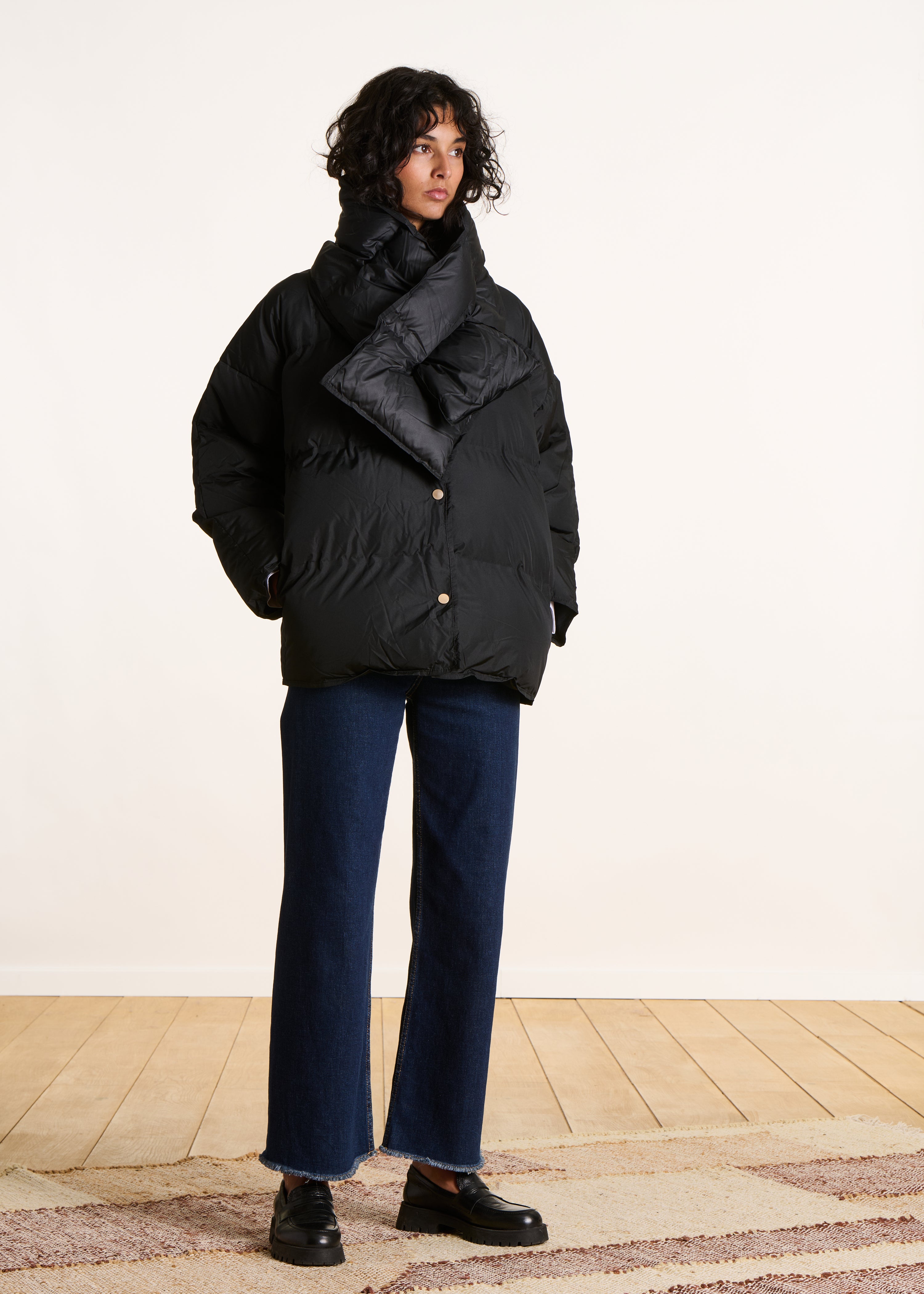 Short black quilted down jacket