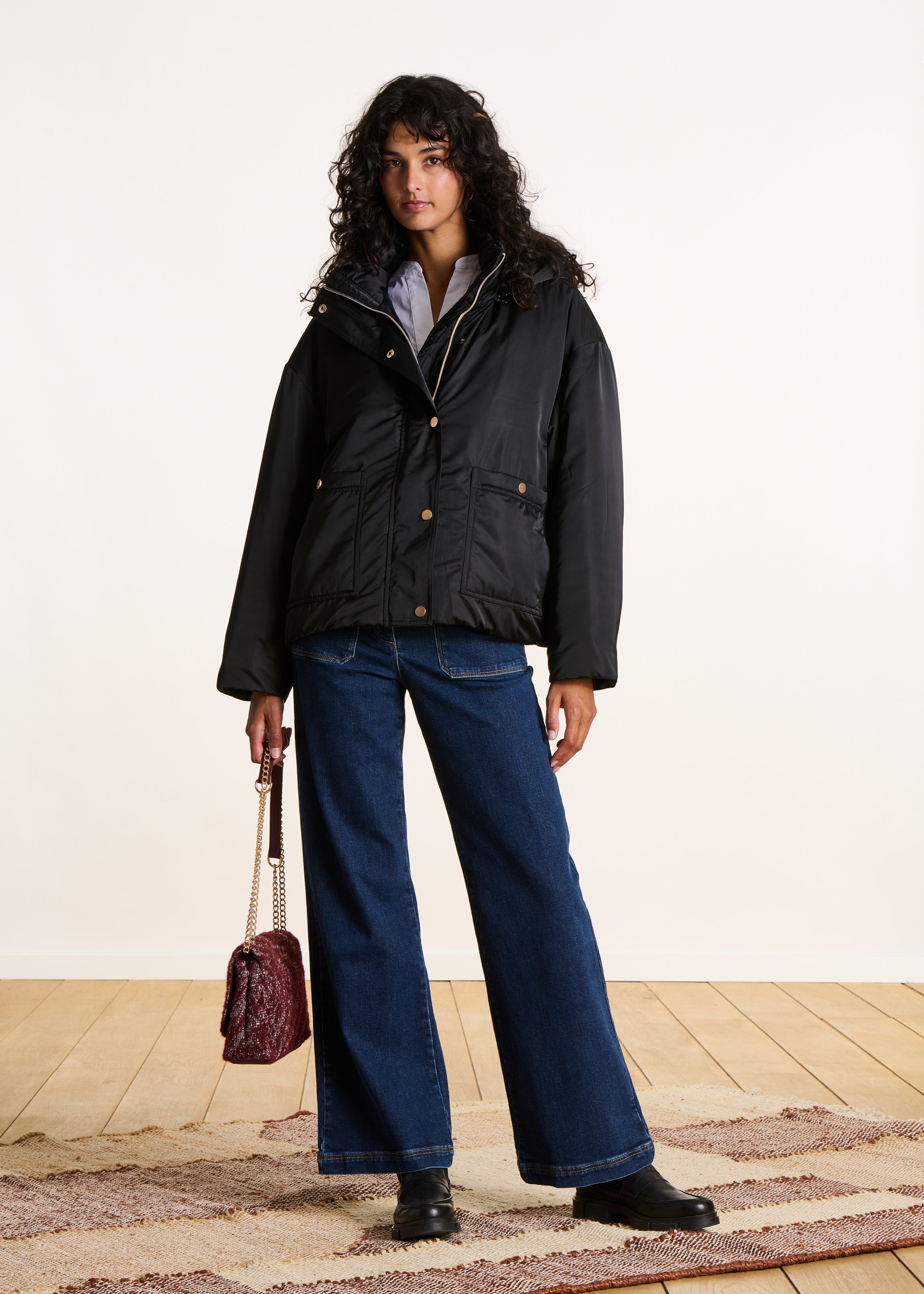 Short black quilted jacket with hood