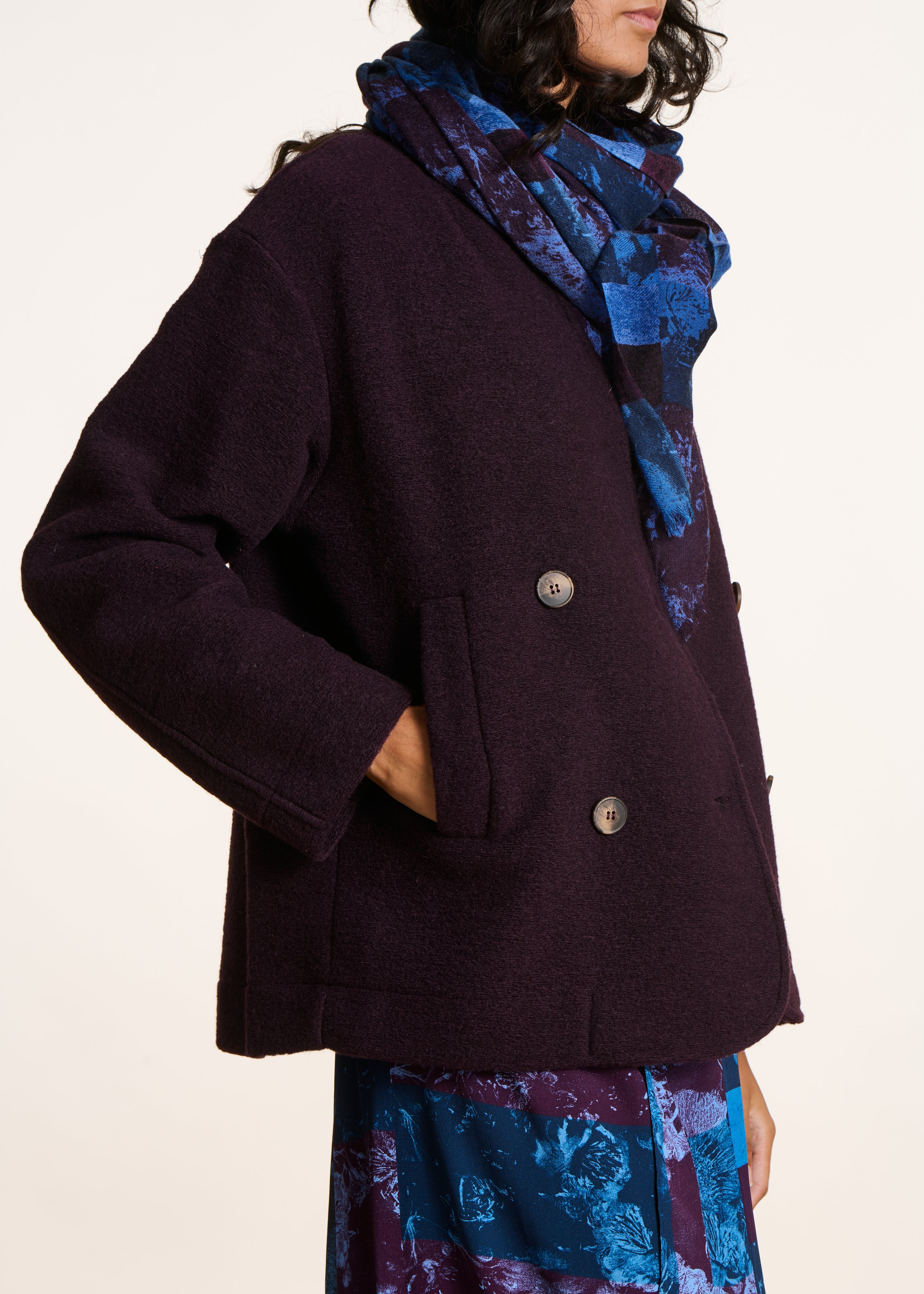 Short plum coat in boiled wool knit