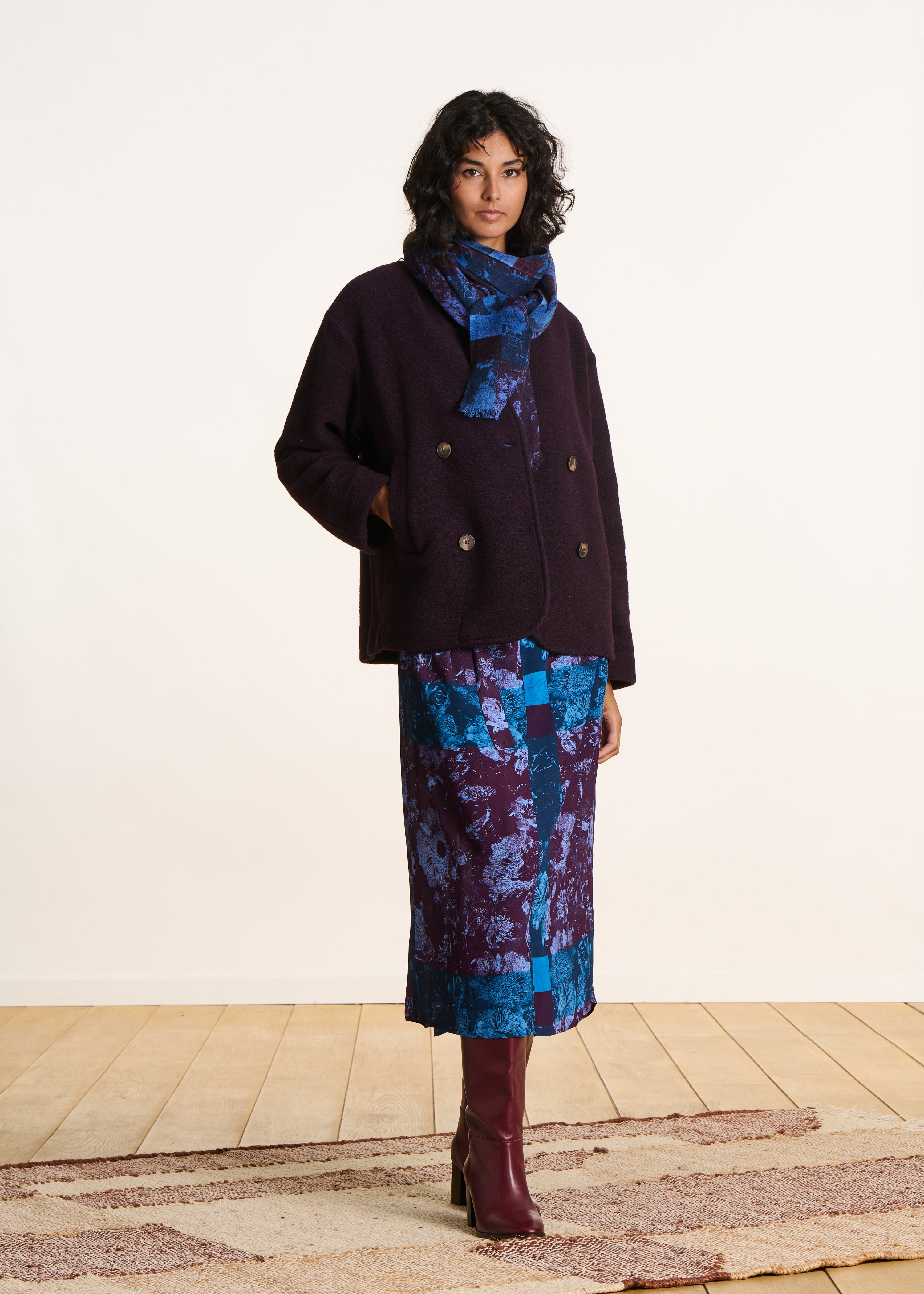 Short plum coat in boiled wool knit