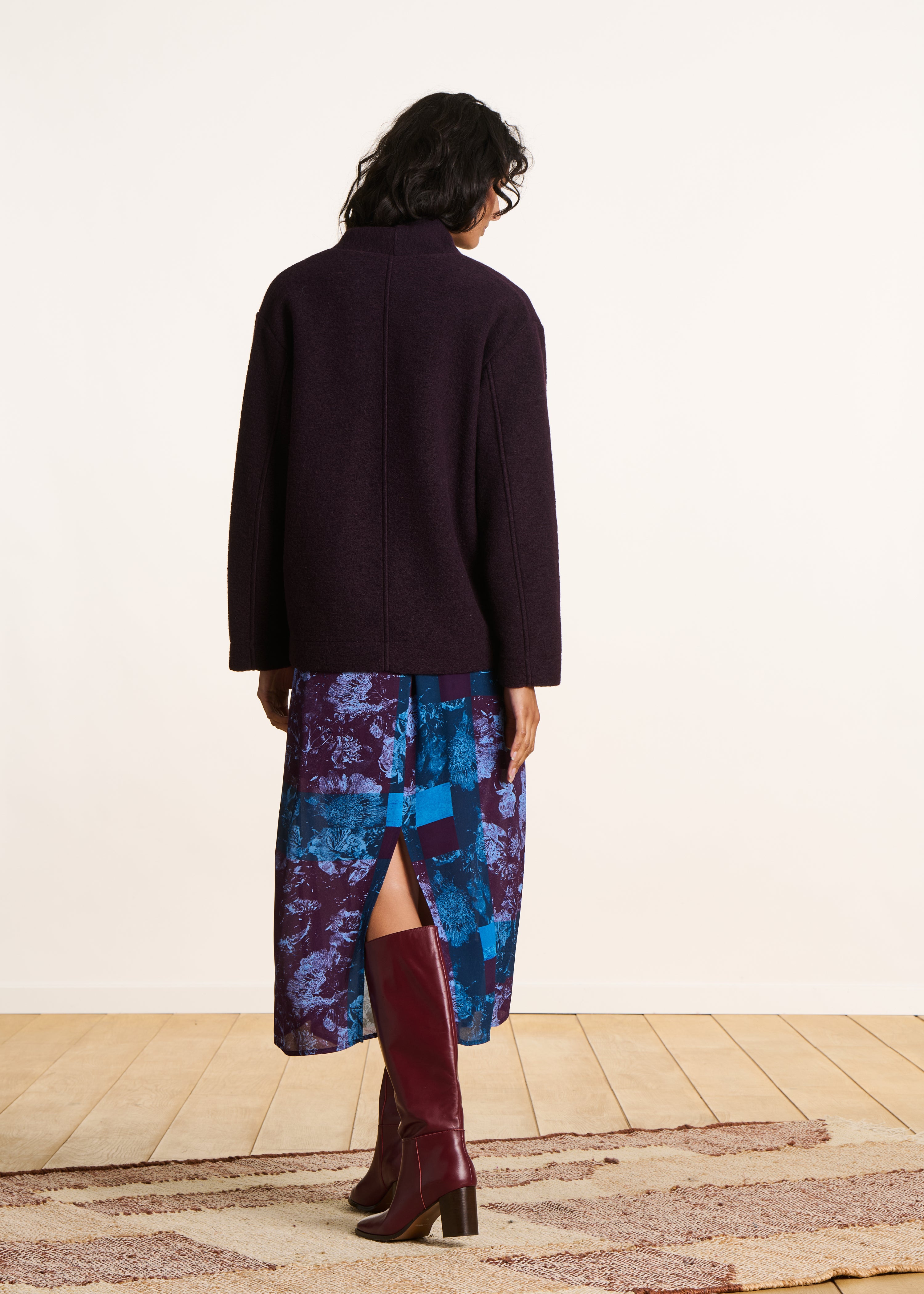 Short plum coat in boiled wool knit