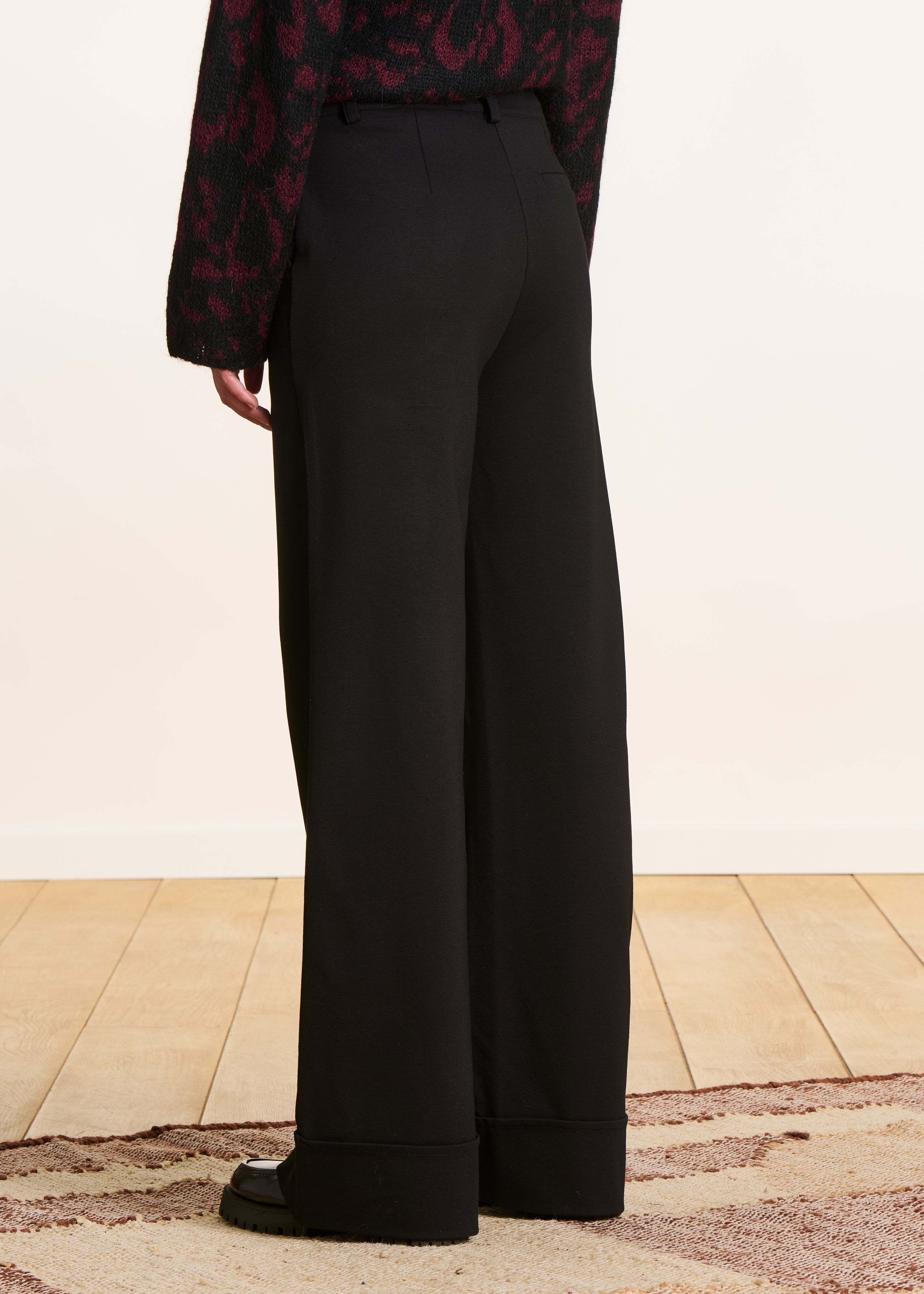High-waisted black milano trousers