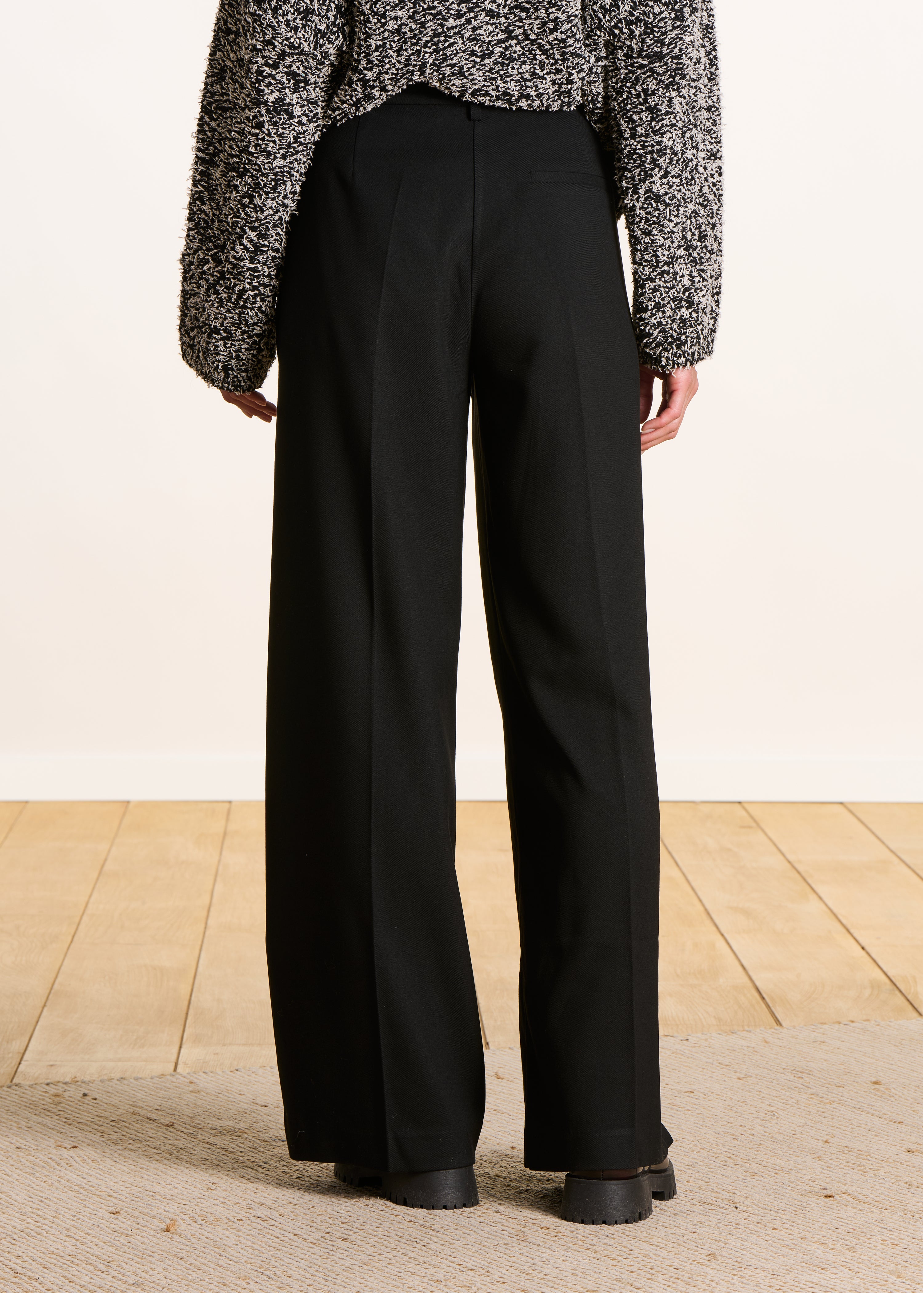 black high-waisted trousers