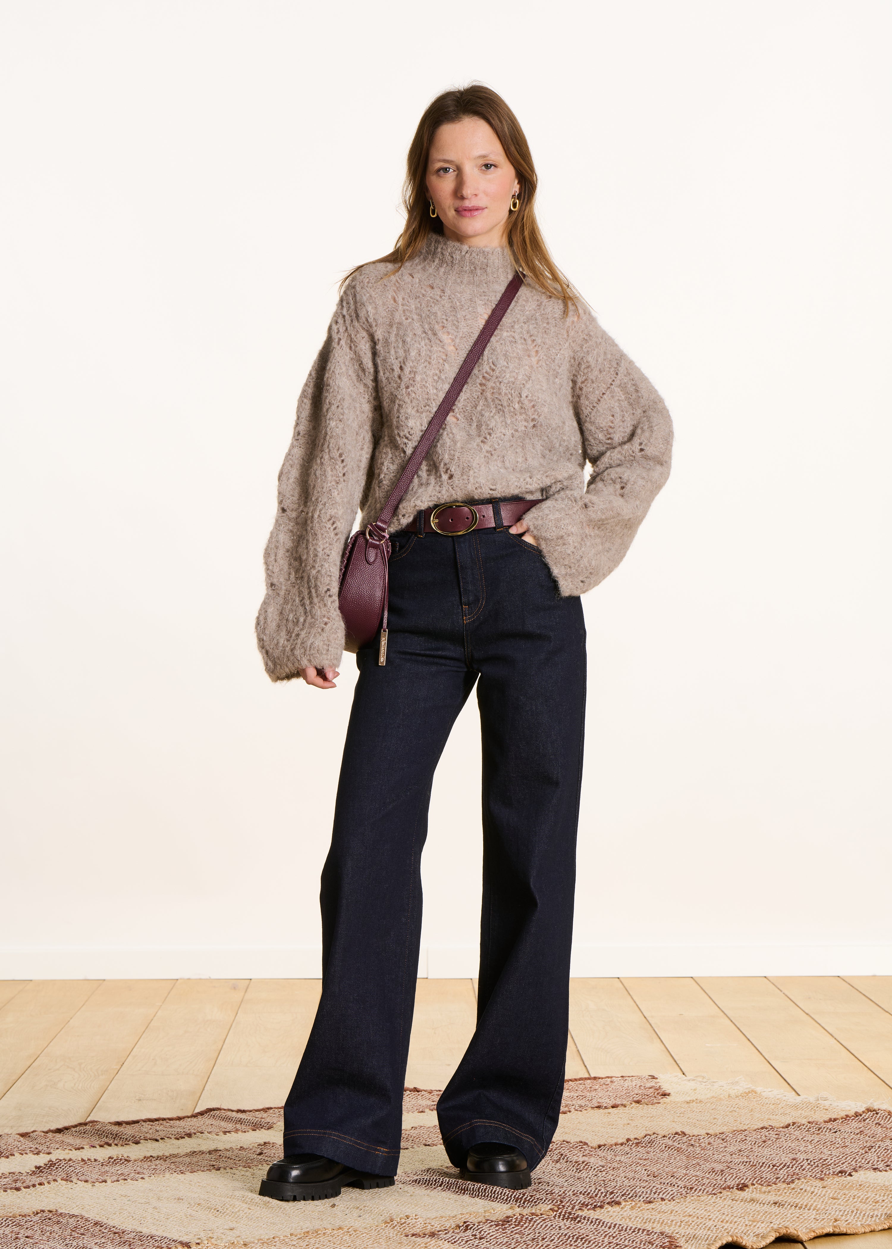 Beige openwork knit pullover with high collar