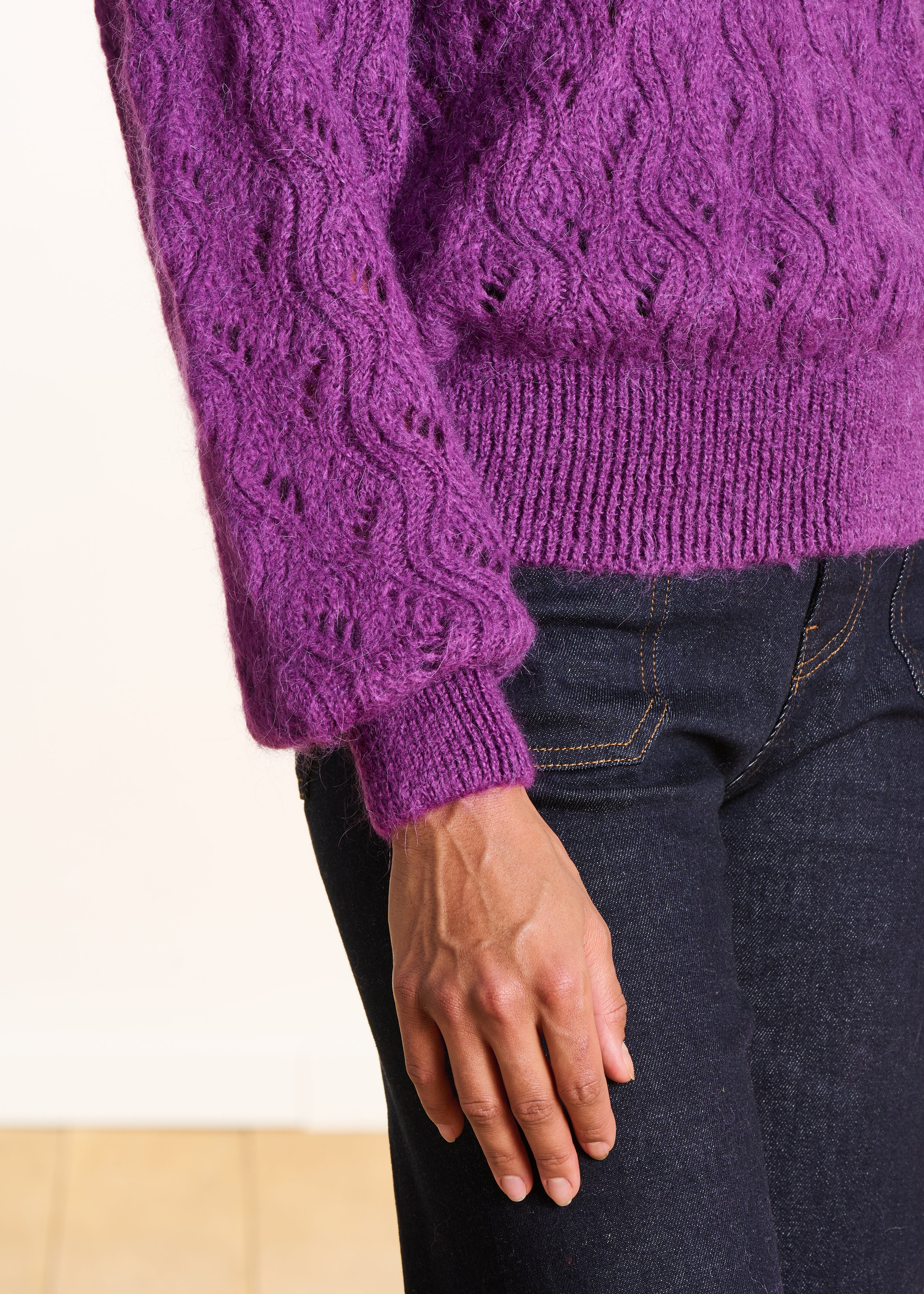 Short purple openwork knit sweater with round neckline