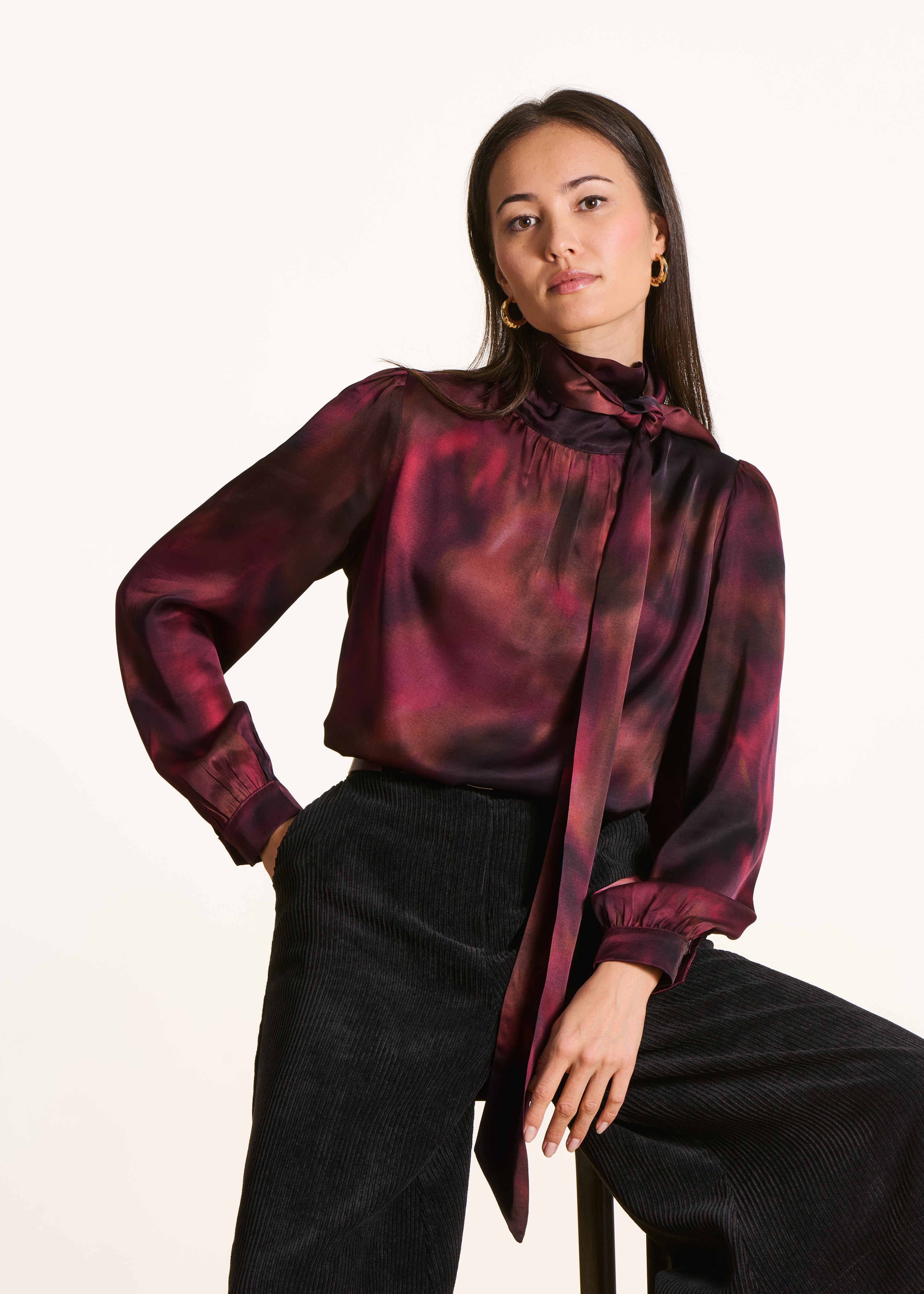 Red printed top with pussy bow collar