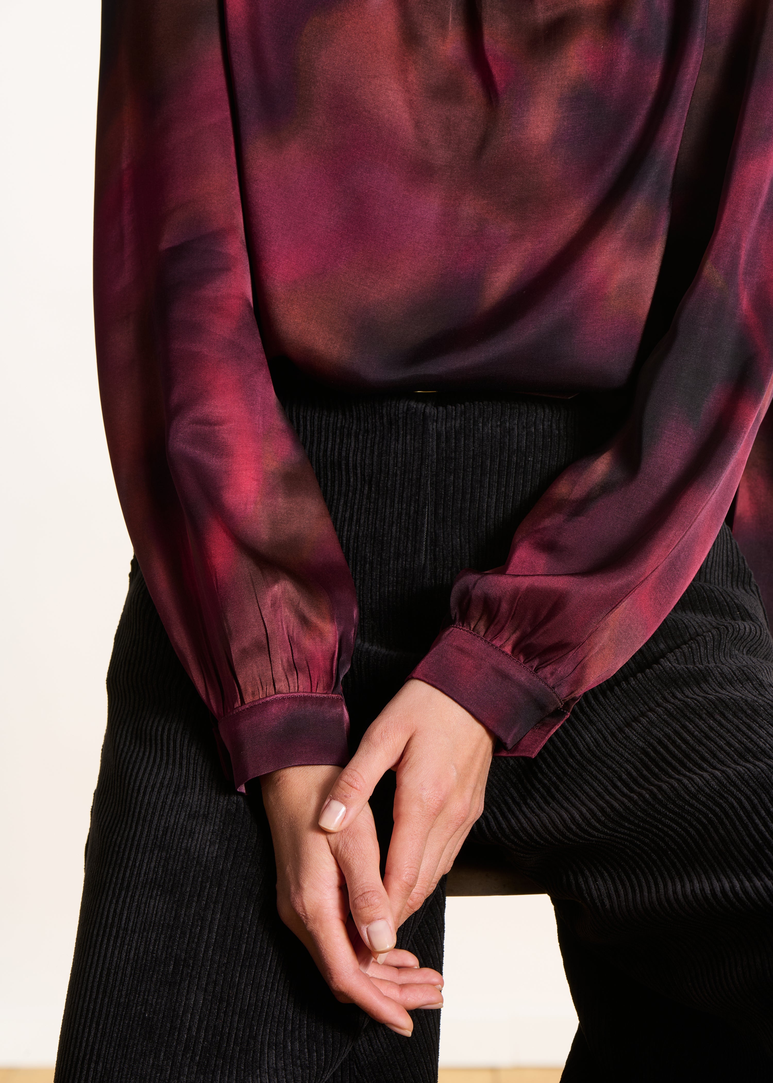 Red printed top with pussy bow collar