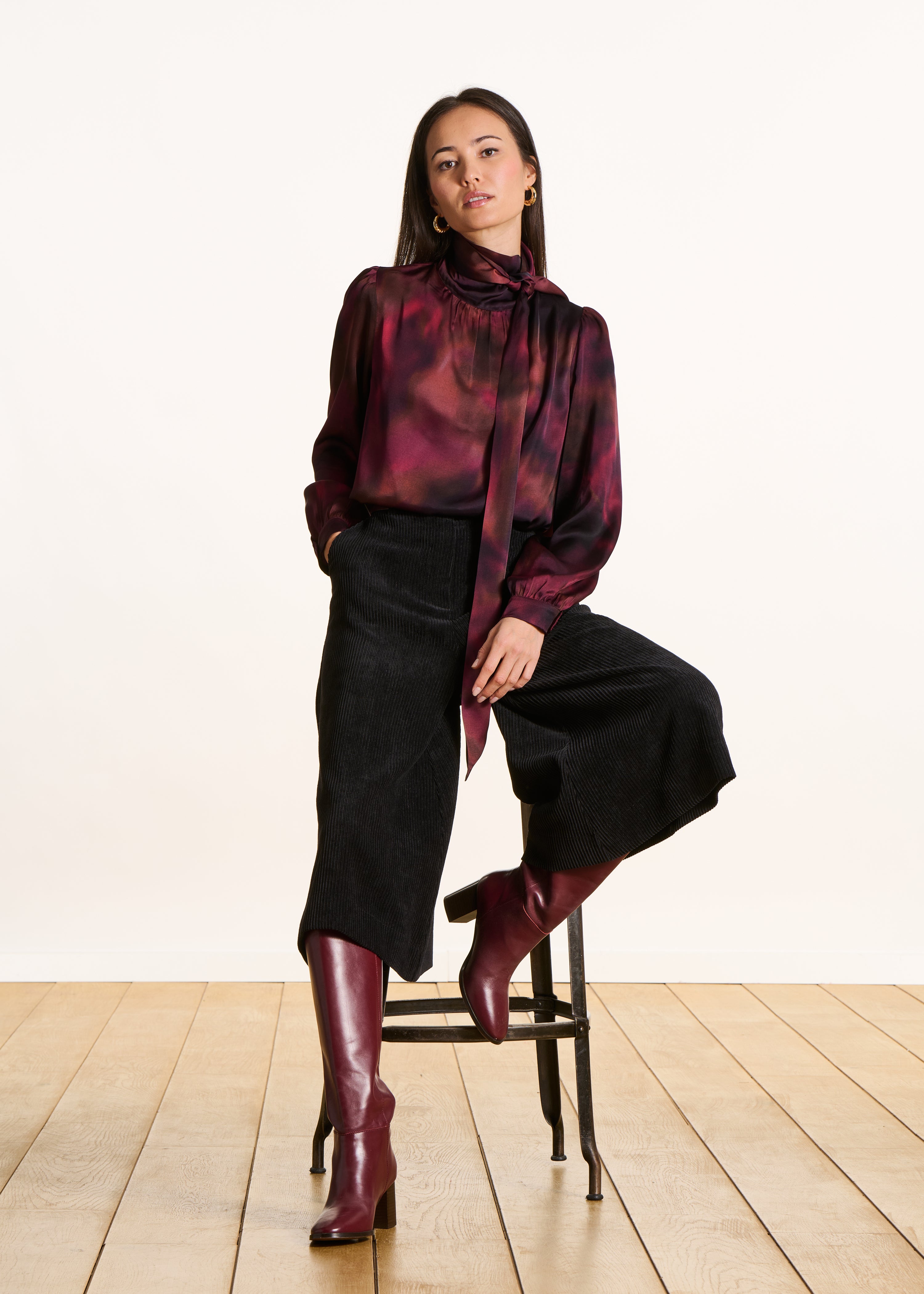 Red printed top with pussy bow collar