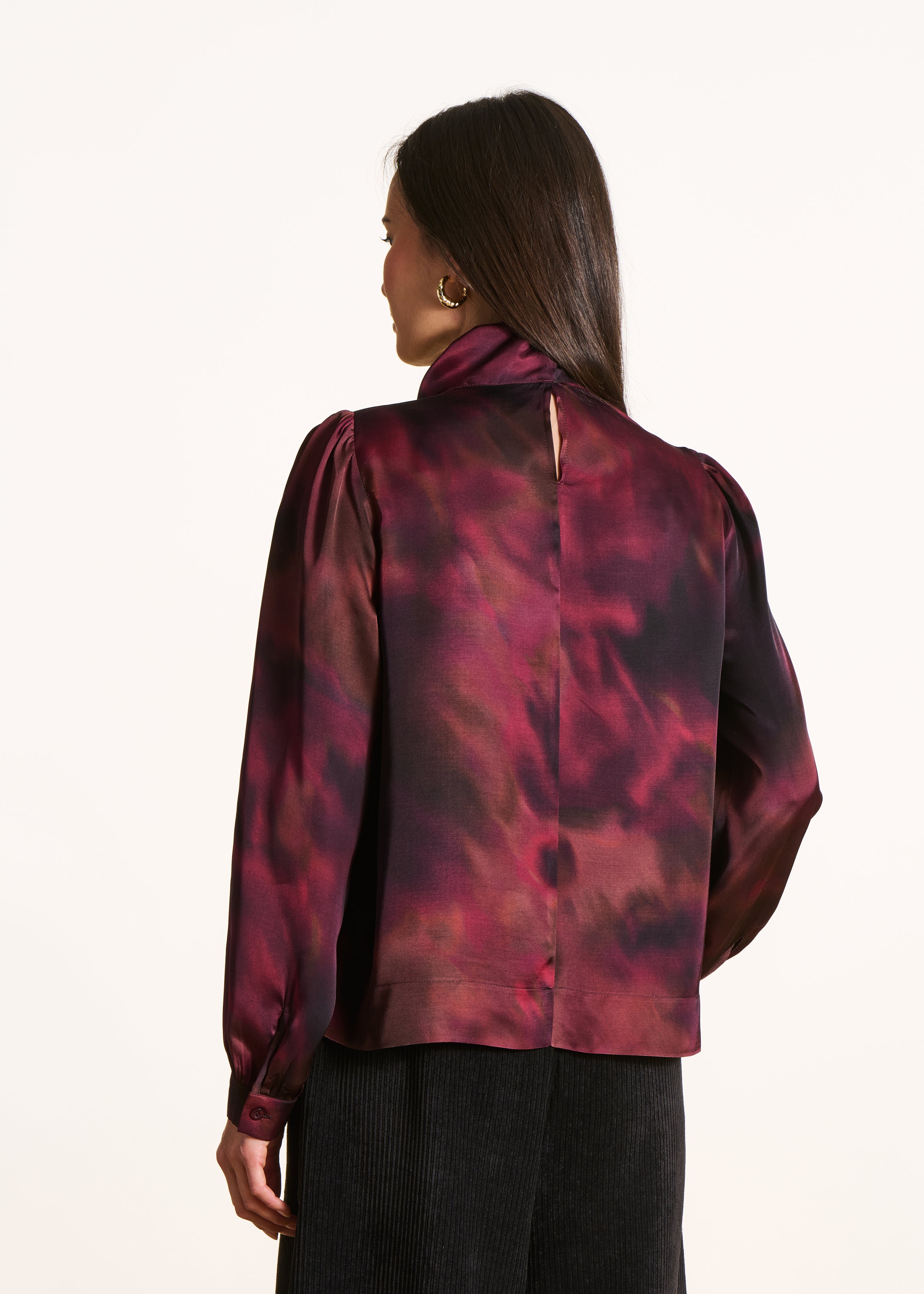 Red printed top with pussy bow collar