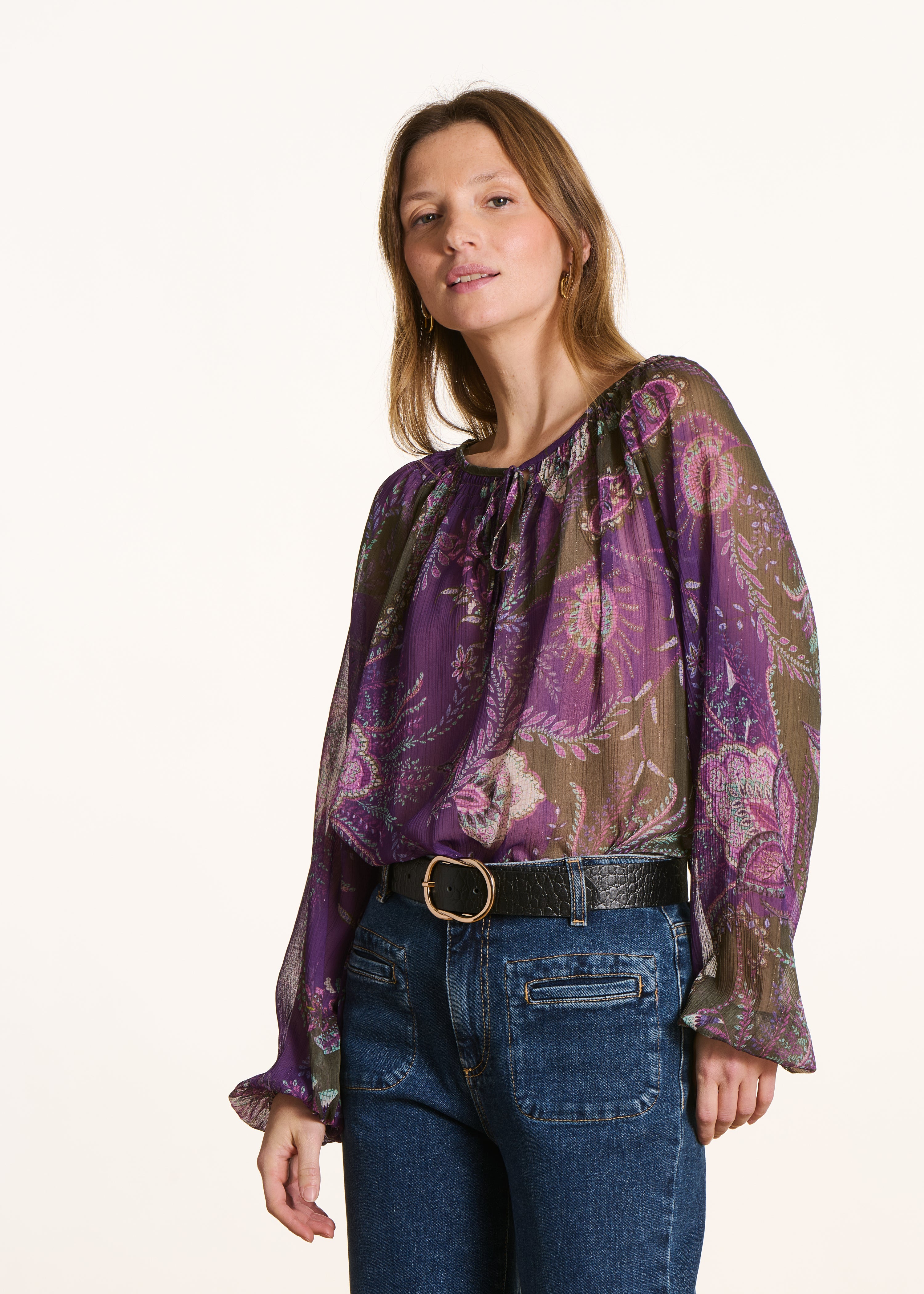 Purple and green long sleeve top with print