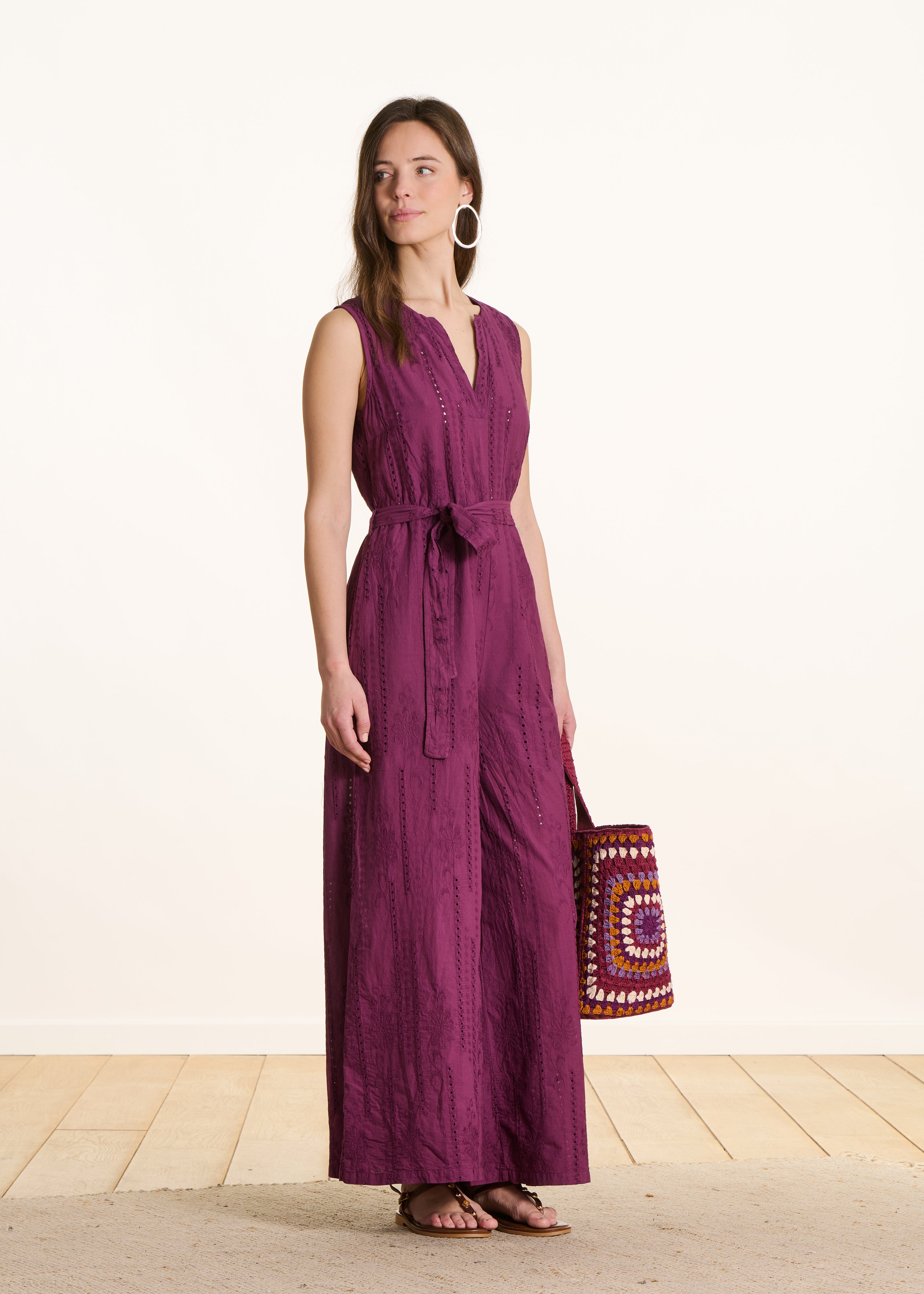 Purple jumpsuit in eyelet embroidery