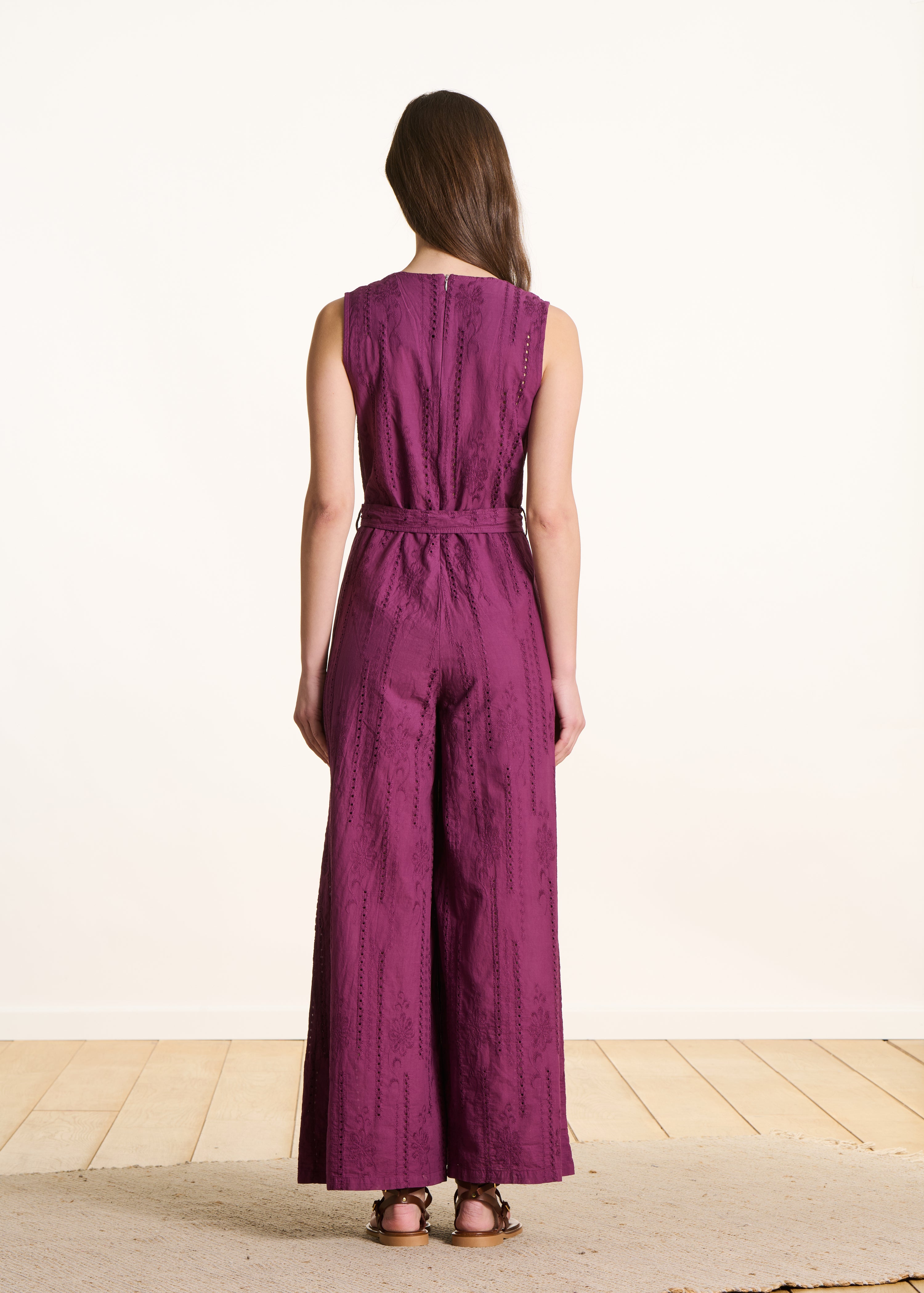Purple jumpsuit in eyelet embroidery