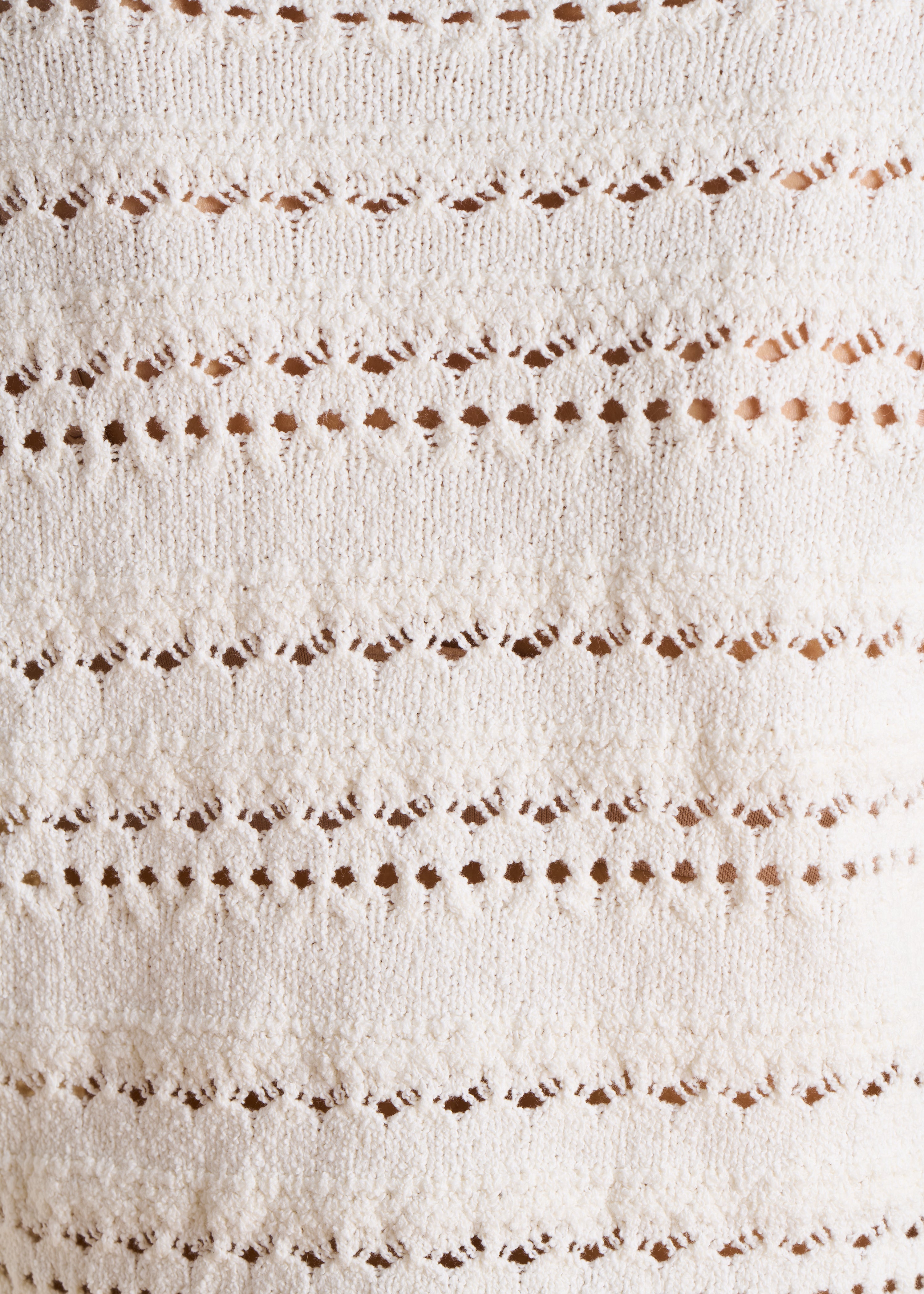 Ecru gilet in opengewerkte stof met fantasieknopen