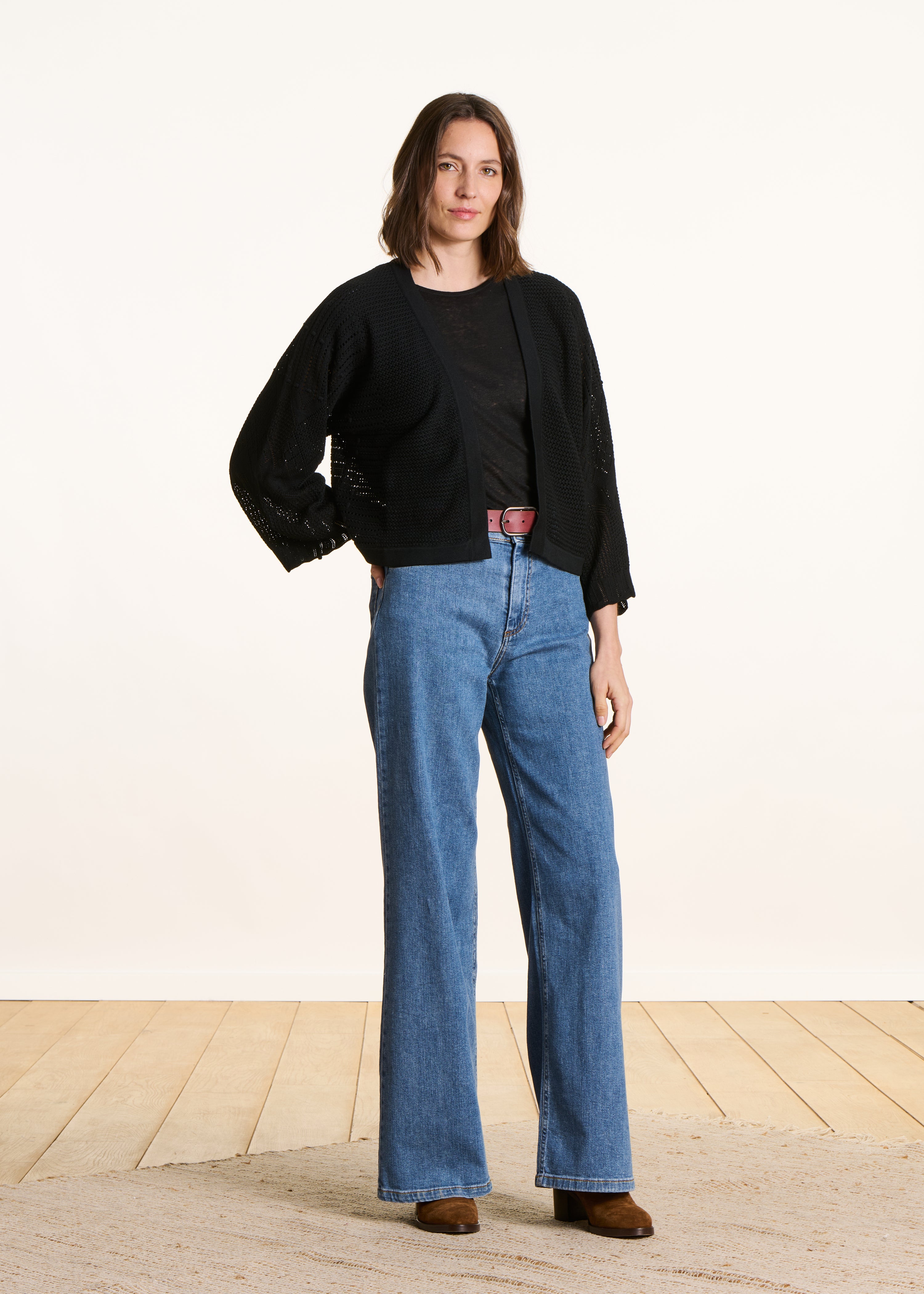 Short black cardigan in pointelle knit