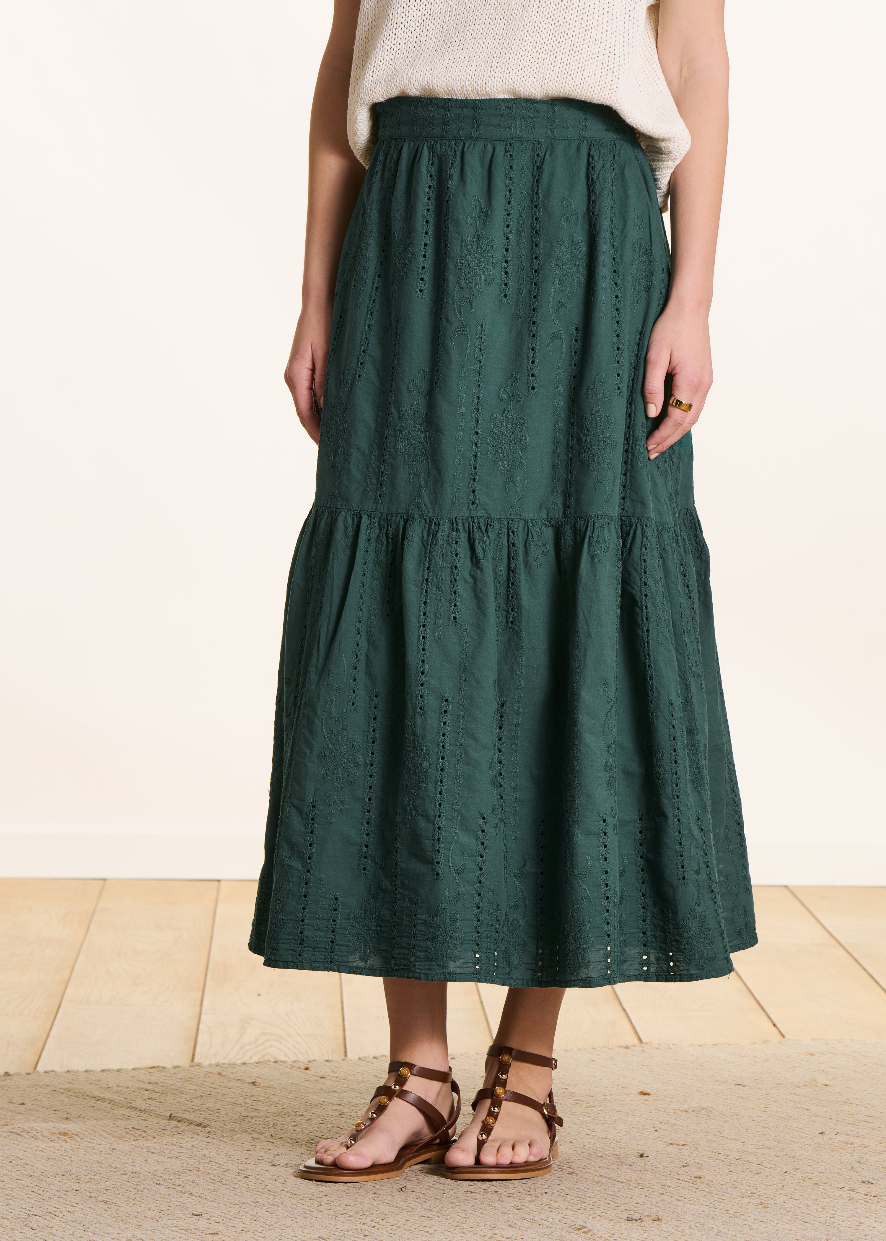 Dark green long skirt with ruffles in eyelet embroidery