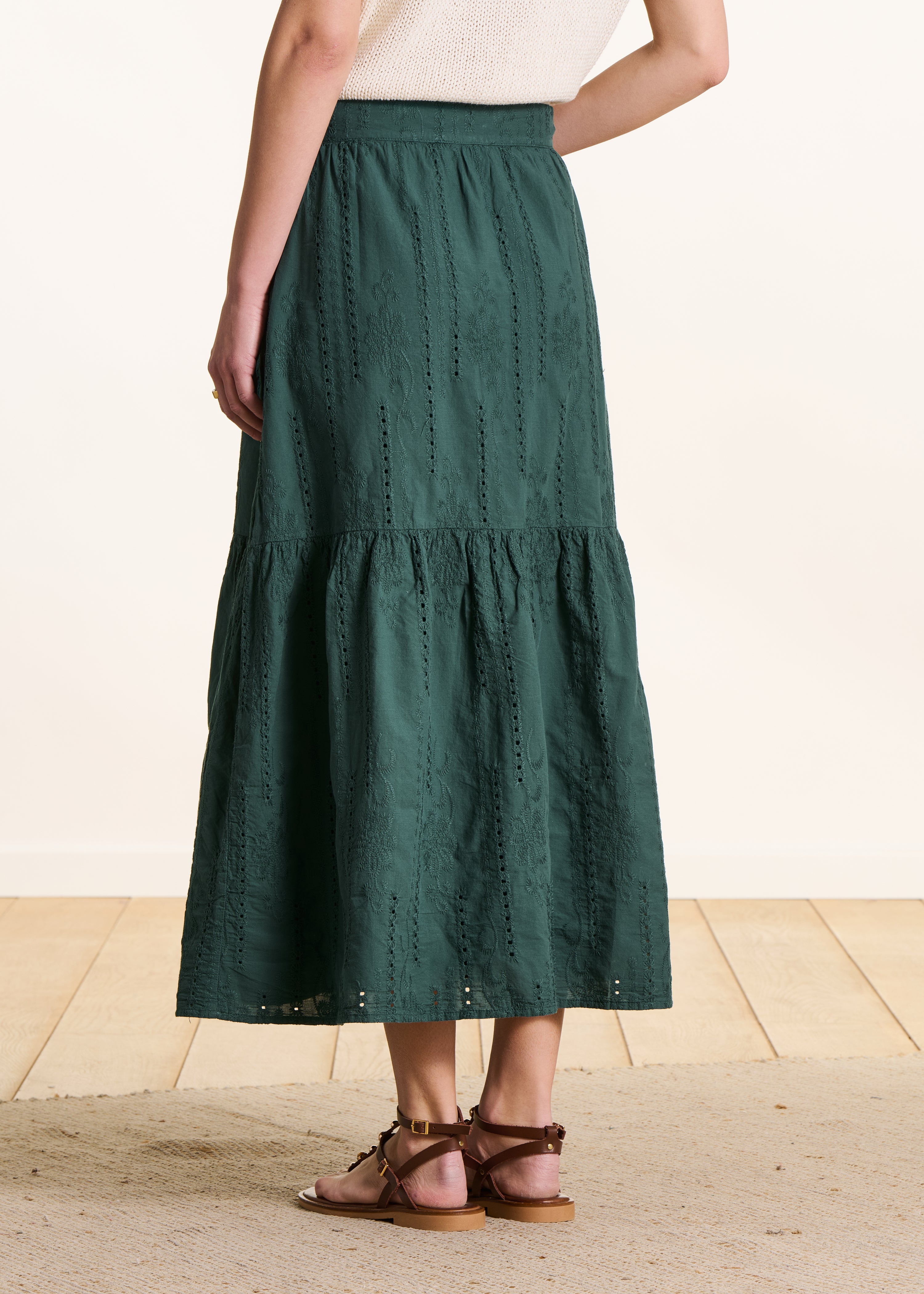 Dark green long skirt with ruffles in eyelet embroidery