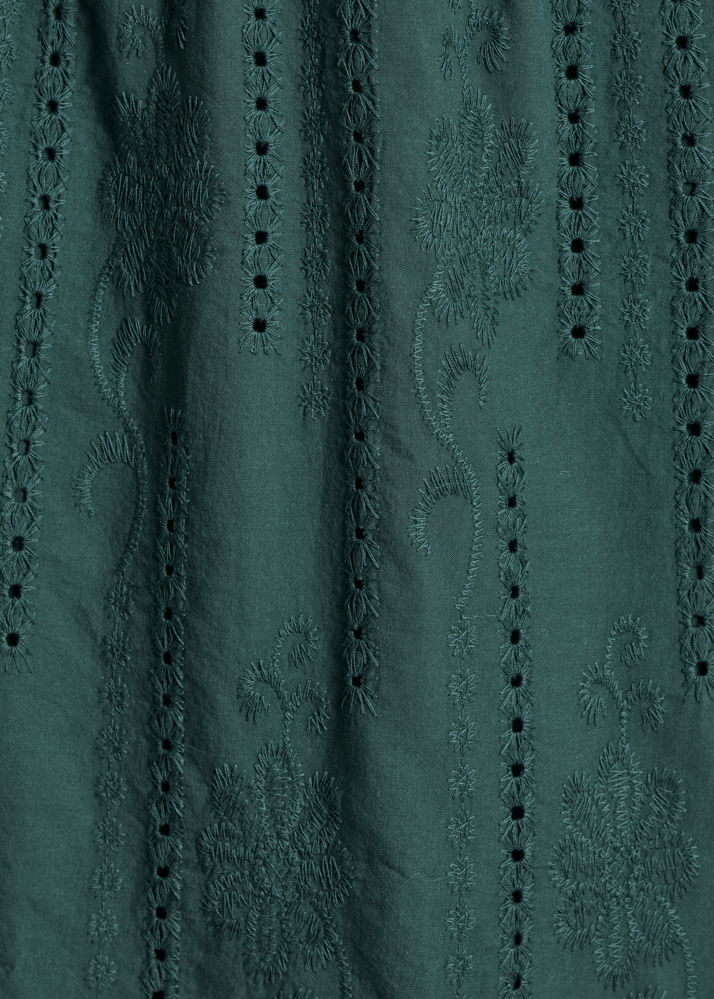Dark green long skirt with ruffles in eyelet embroidery