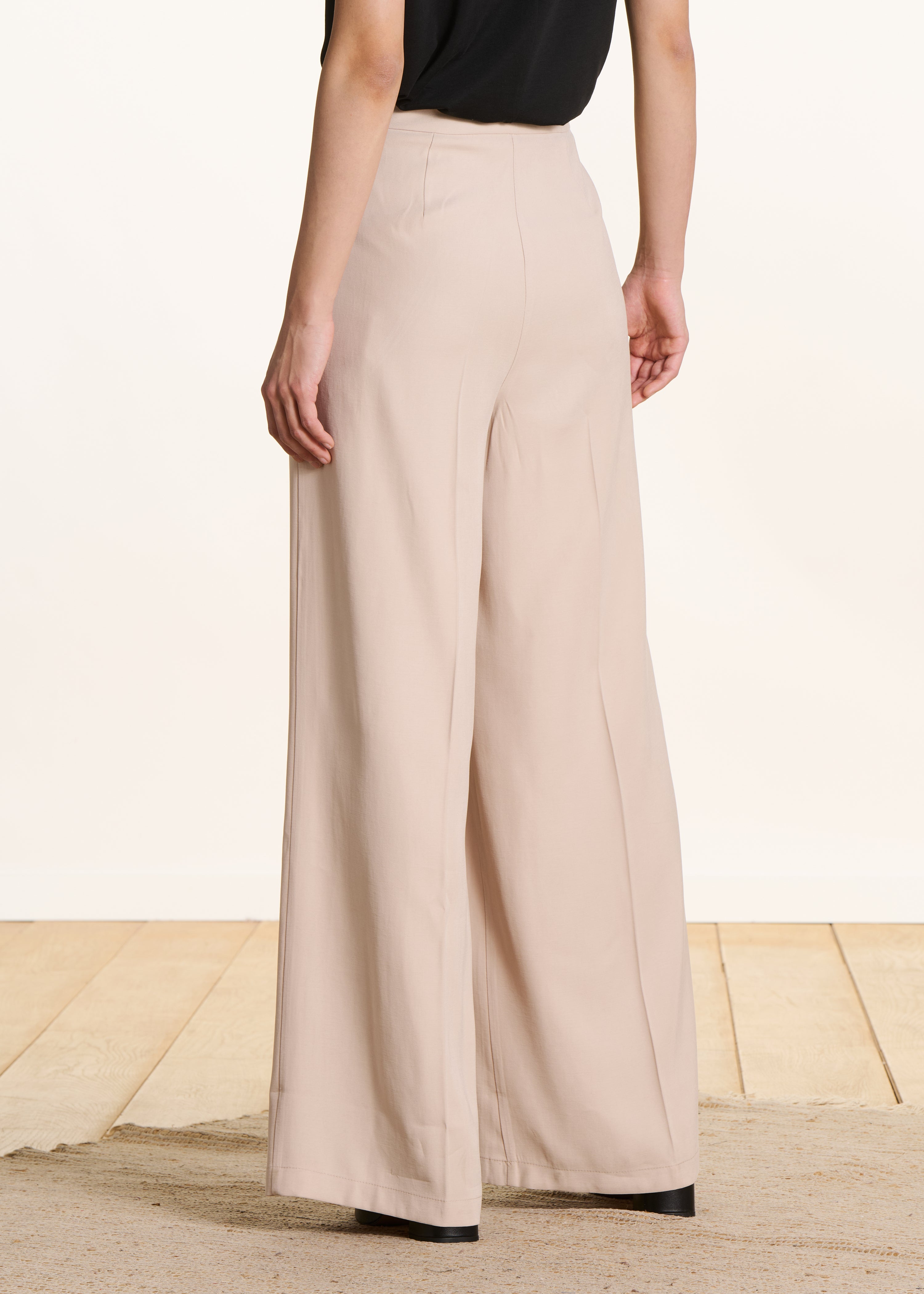 Wide beige high-waisted trousers