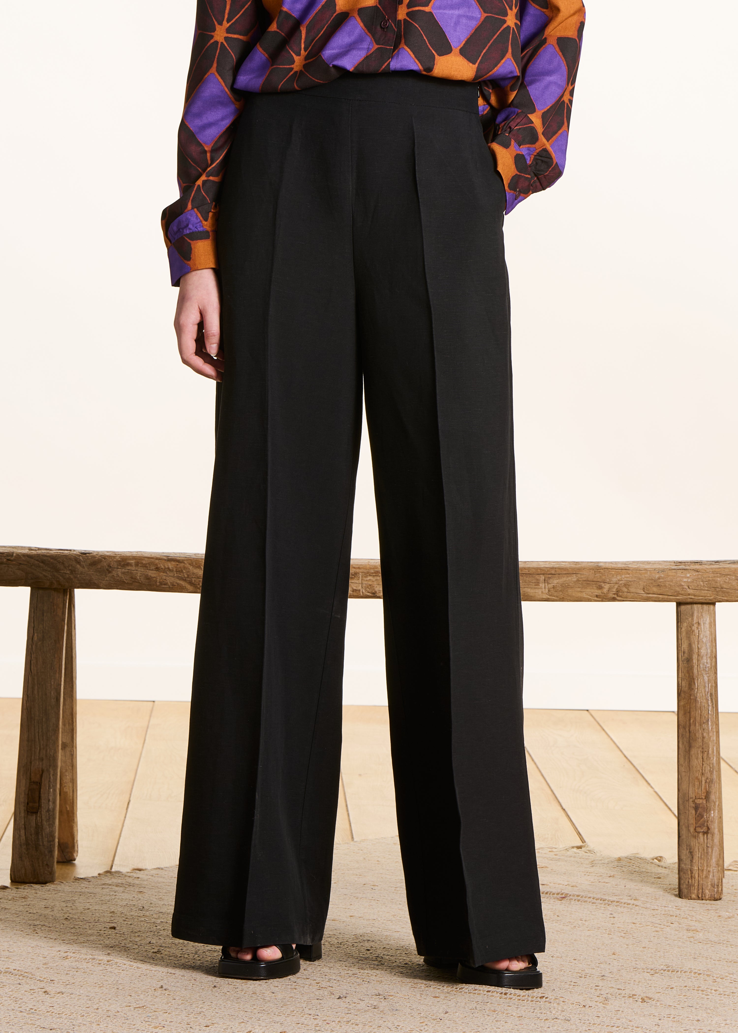 Wide black high-waisted trousers