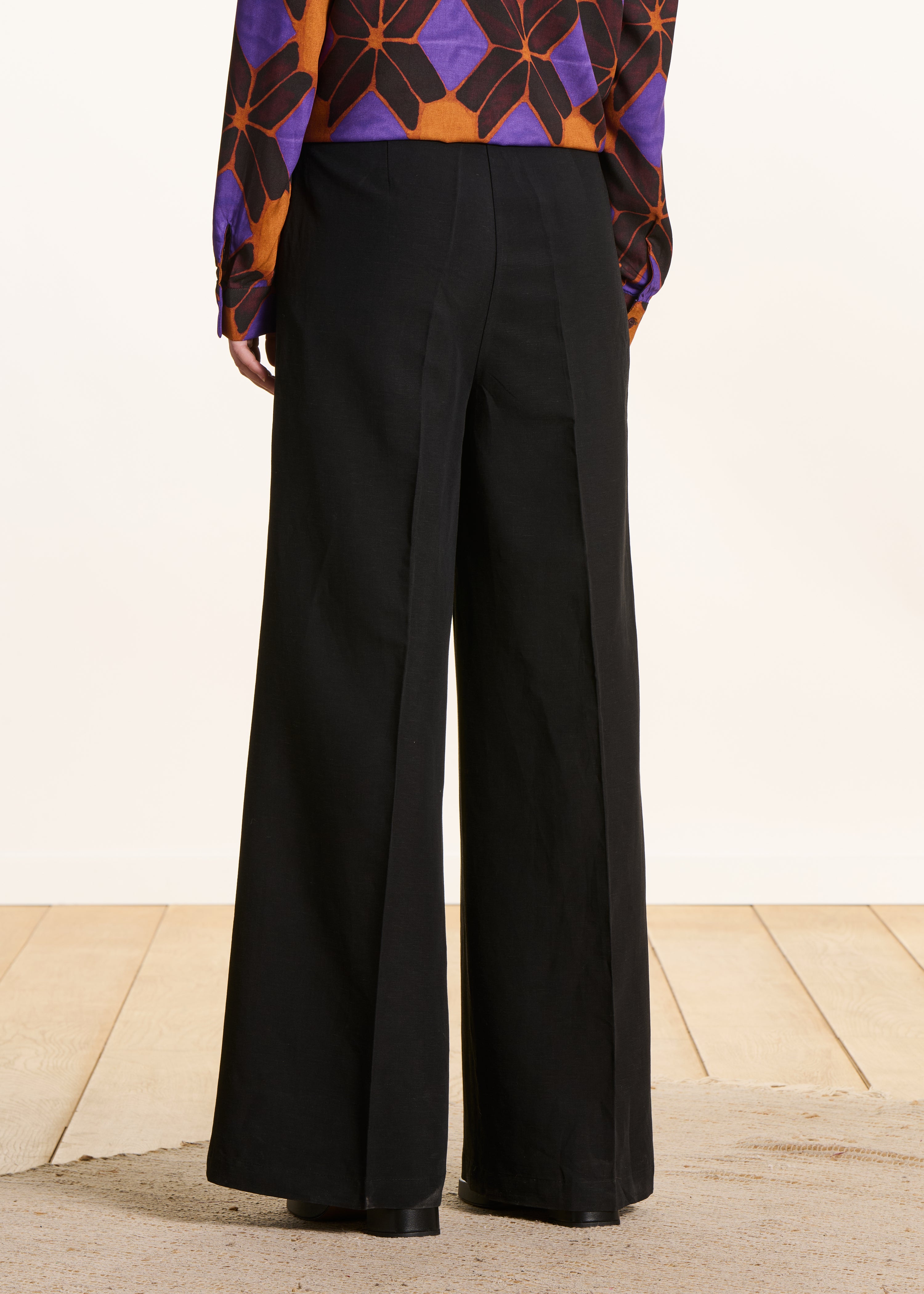 Wide black high-waisted trousers