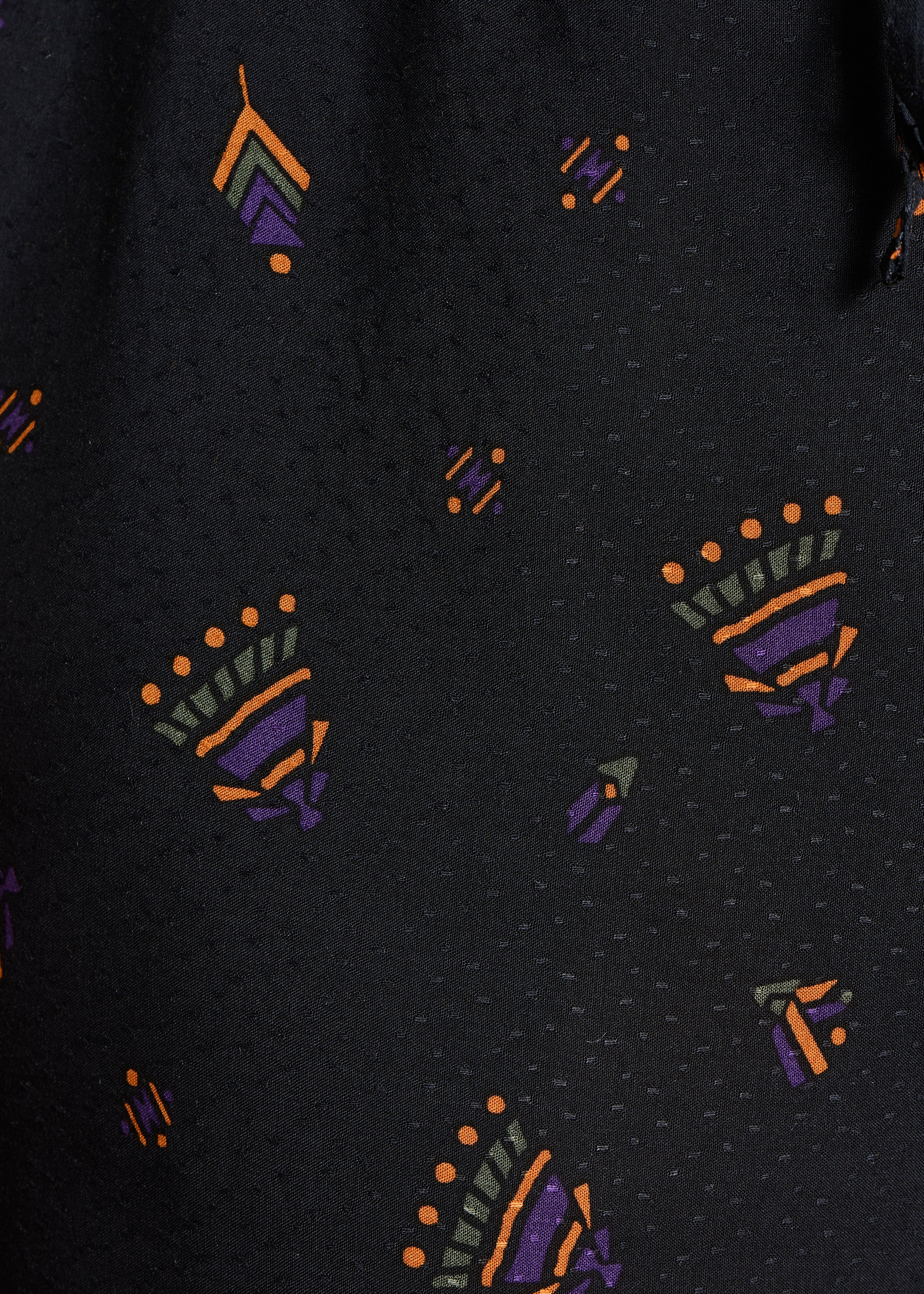 Pantalon large noir à imprimé