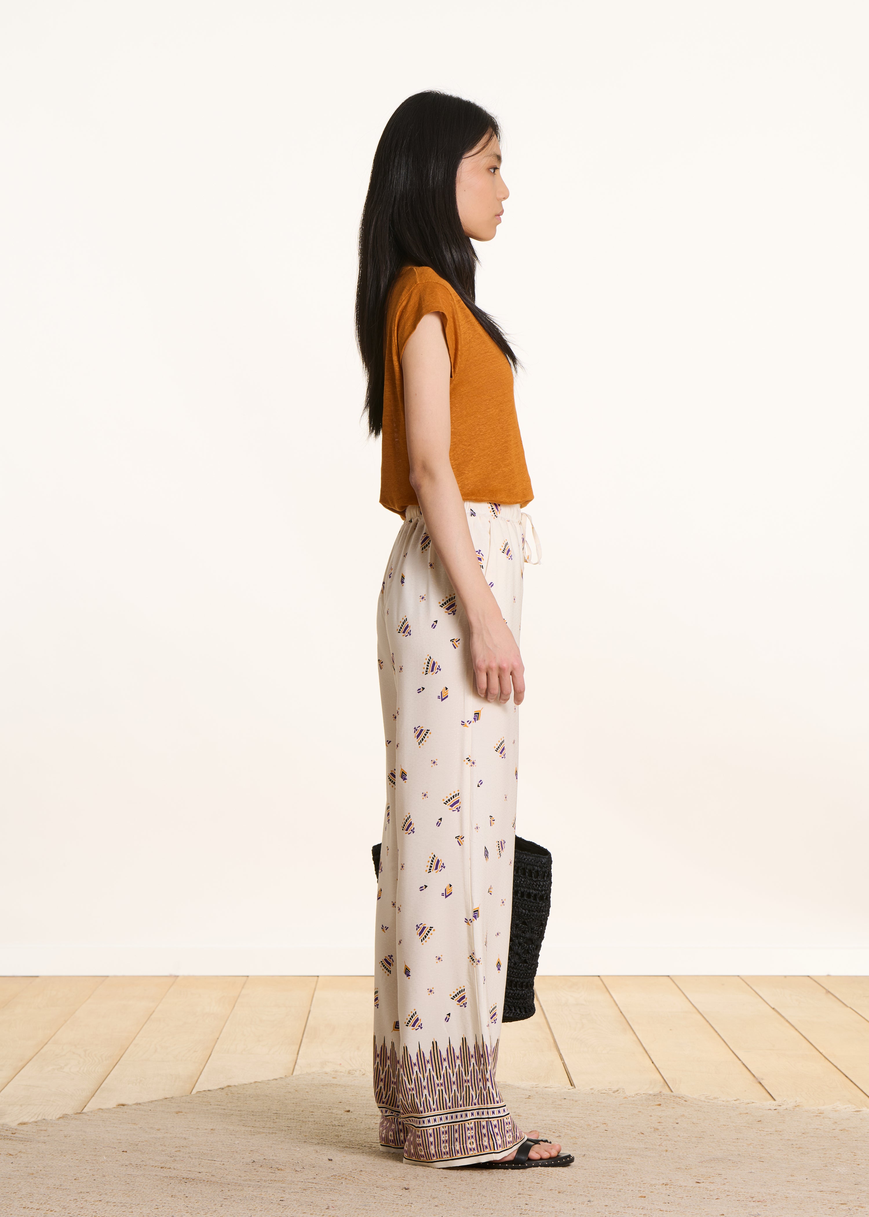 Pantalone largo écru con stampa