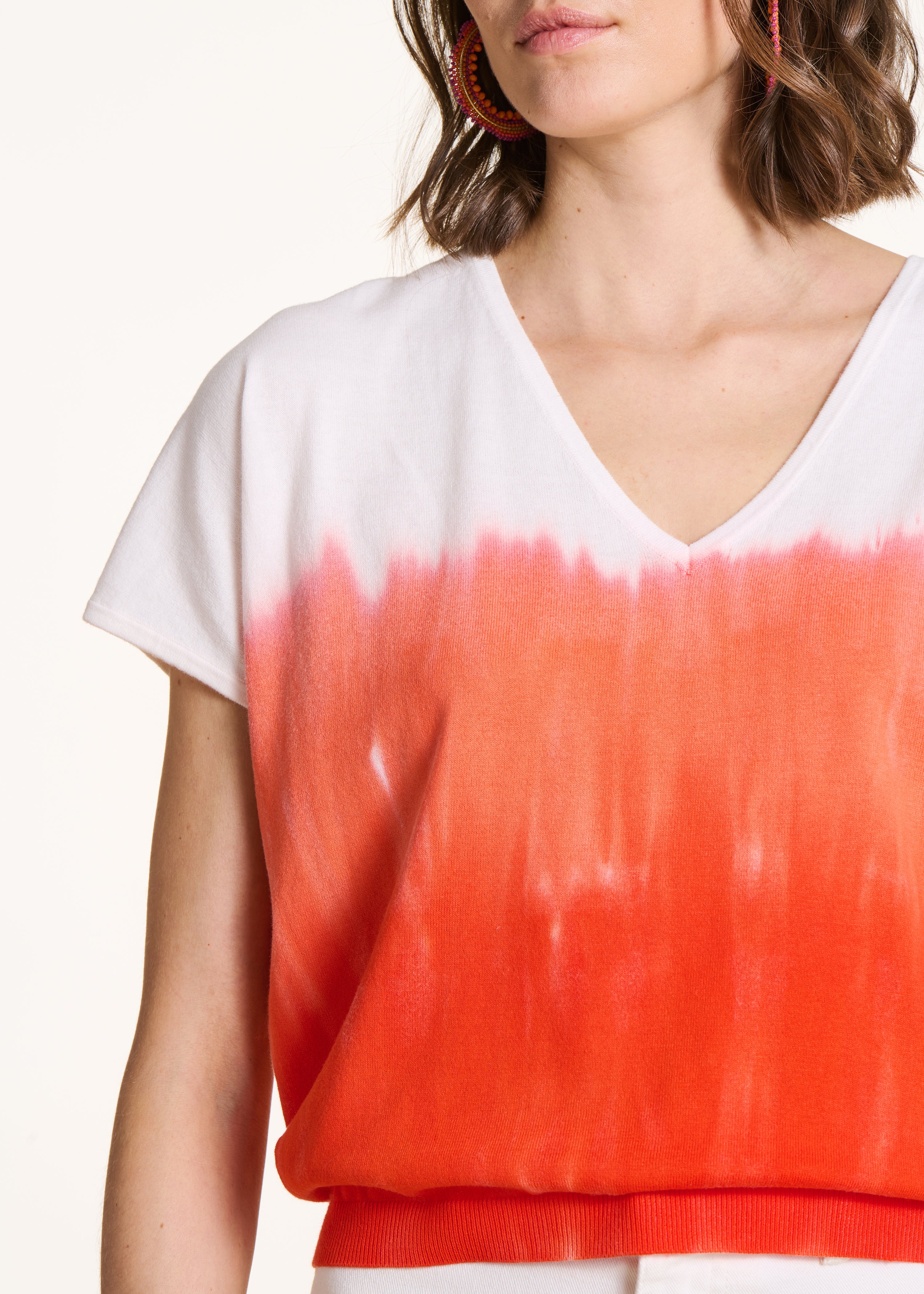 Maglione in cotone biologico con stampa tie & dye arancione