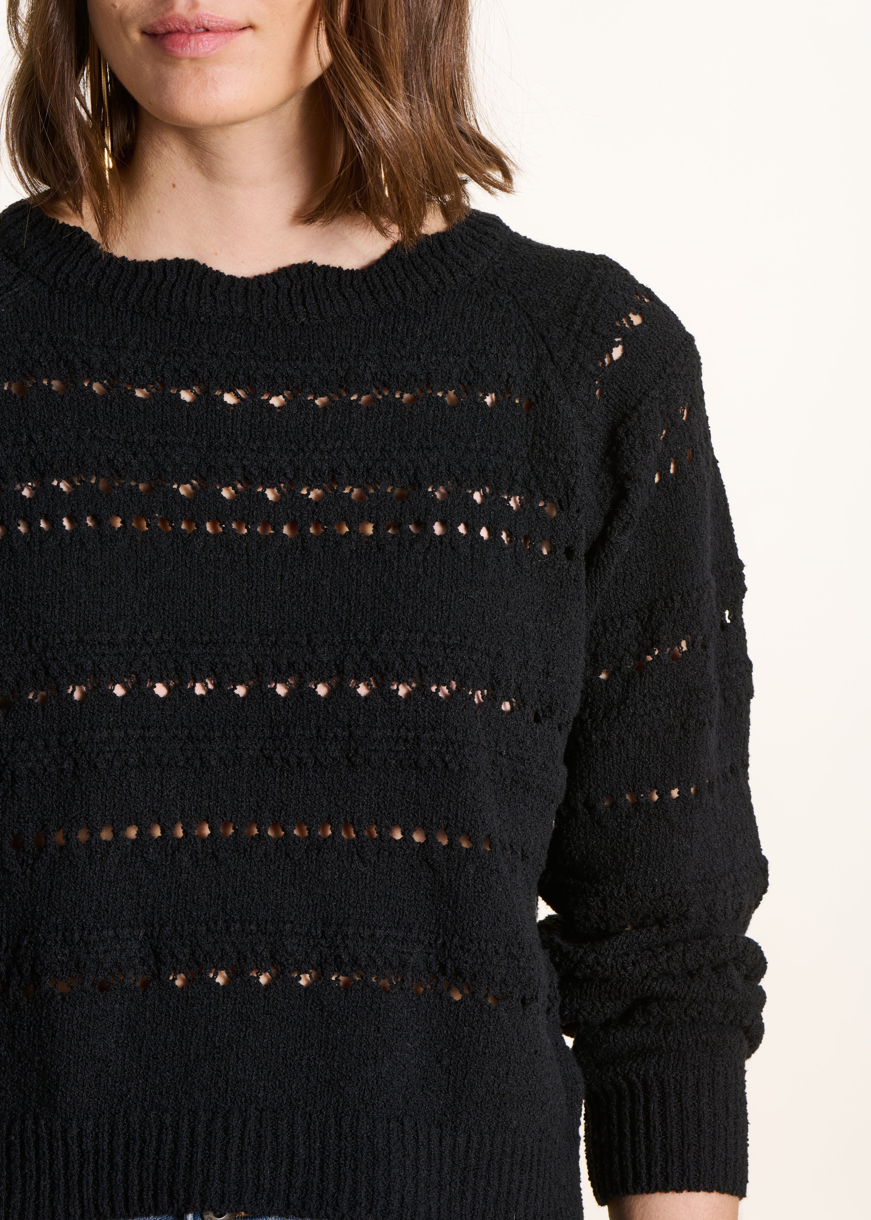 Black openwork knit sweater with long sleeves