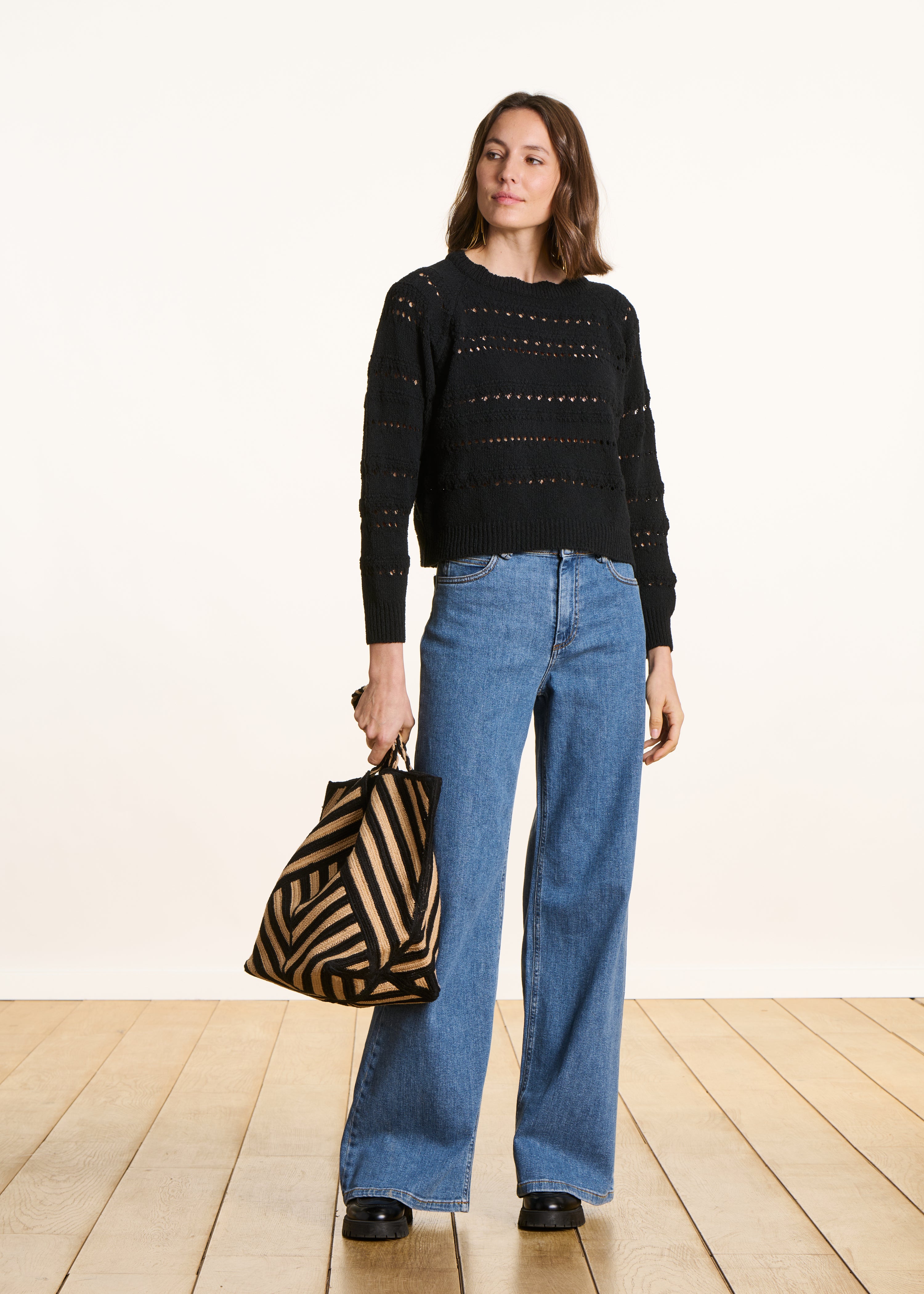 Black openwork knit sweater with long sleeves