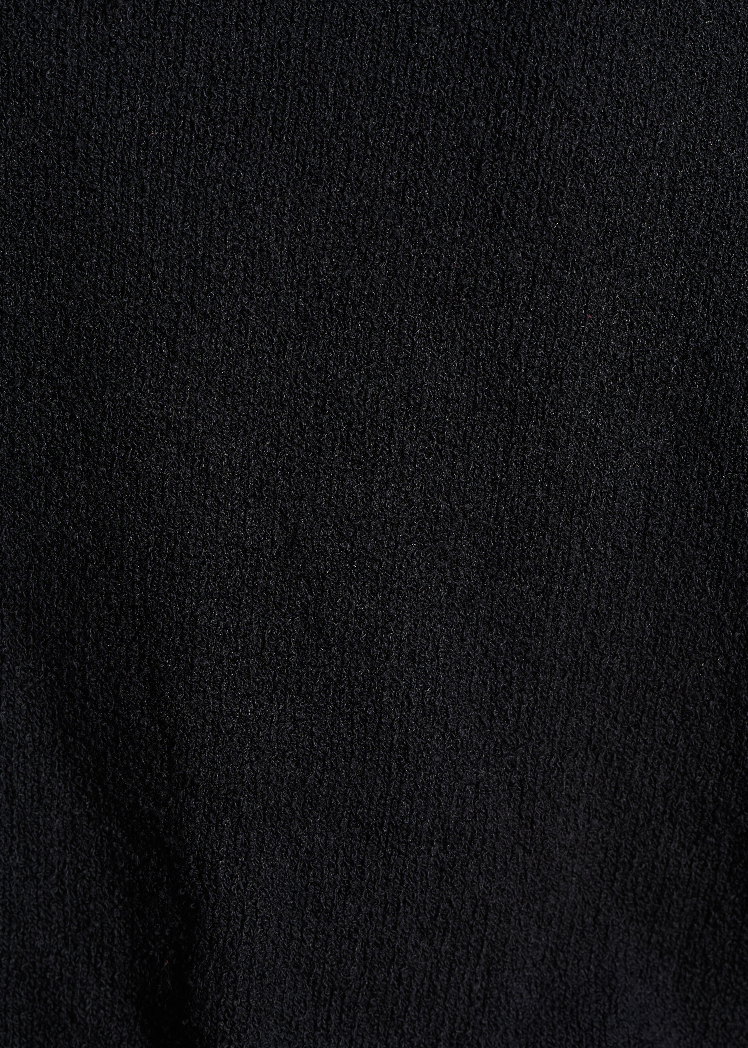 Loose black sweater in openwork knit with short sleeves