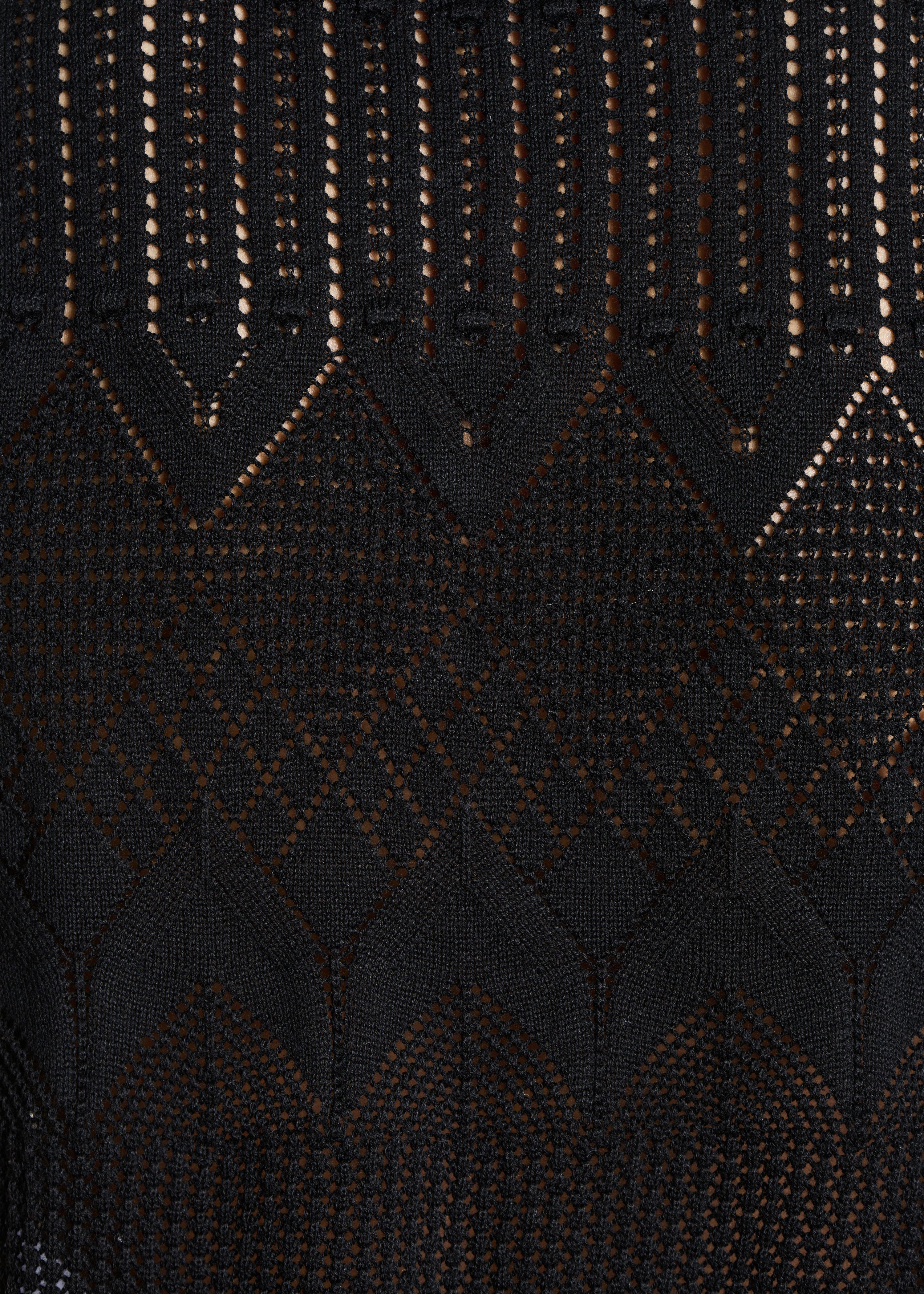 Jersey corto negro sin mangas en punto calado