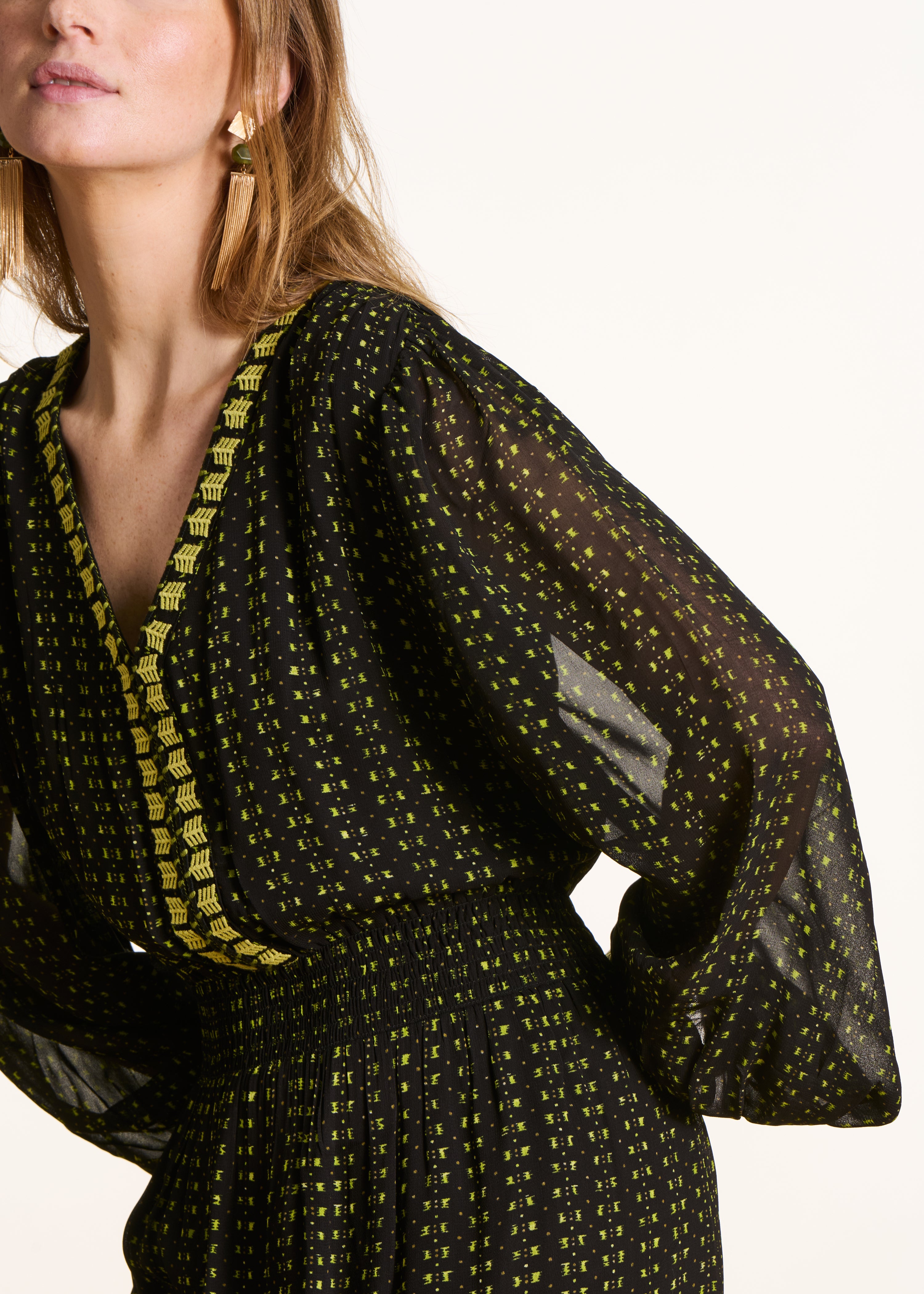 Long fitted green printed dress with long sleeves